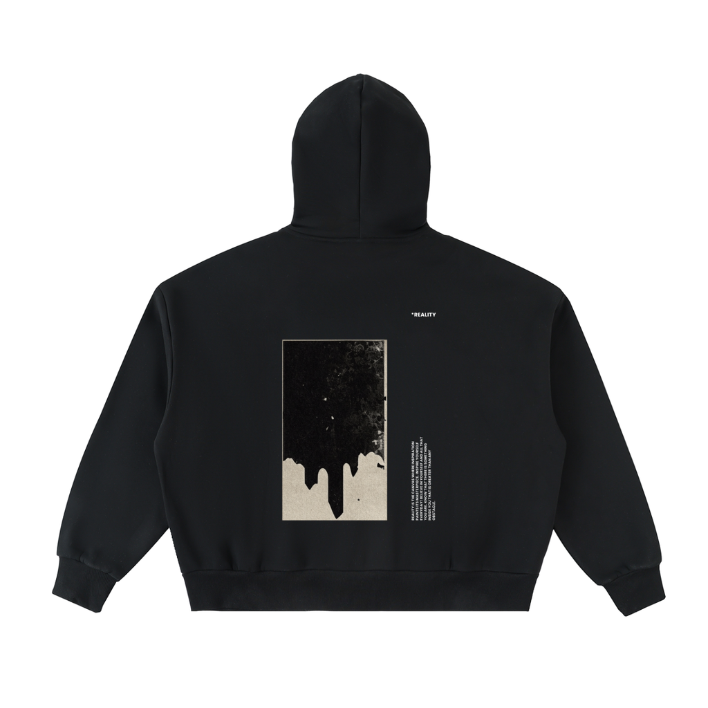 A black pullover hoodie shown from the back, featuring a large rectangular graphic print with a dripping ink design in black and beige, alongside small white text, on a plain white background.