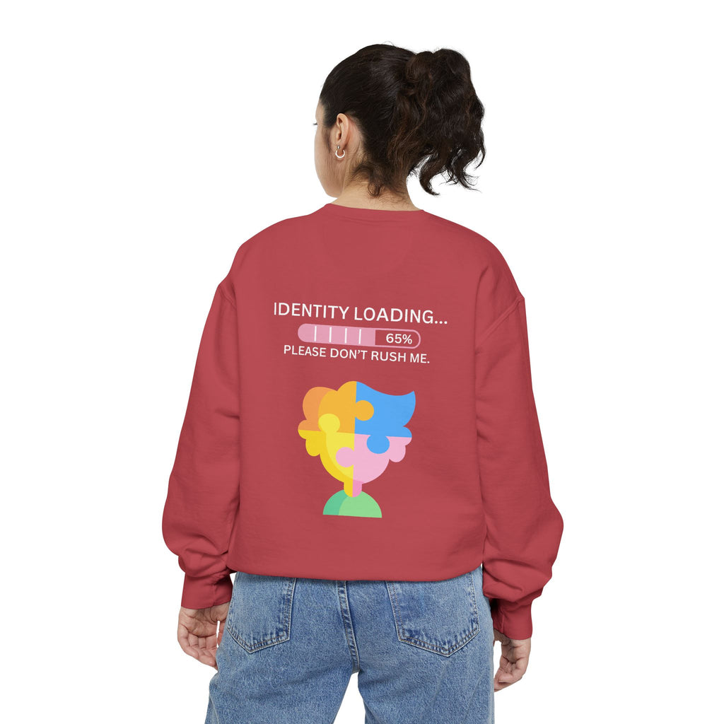 Person wearing a red sweatshirt with a colorful graphic and text on the back, on a white background