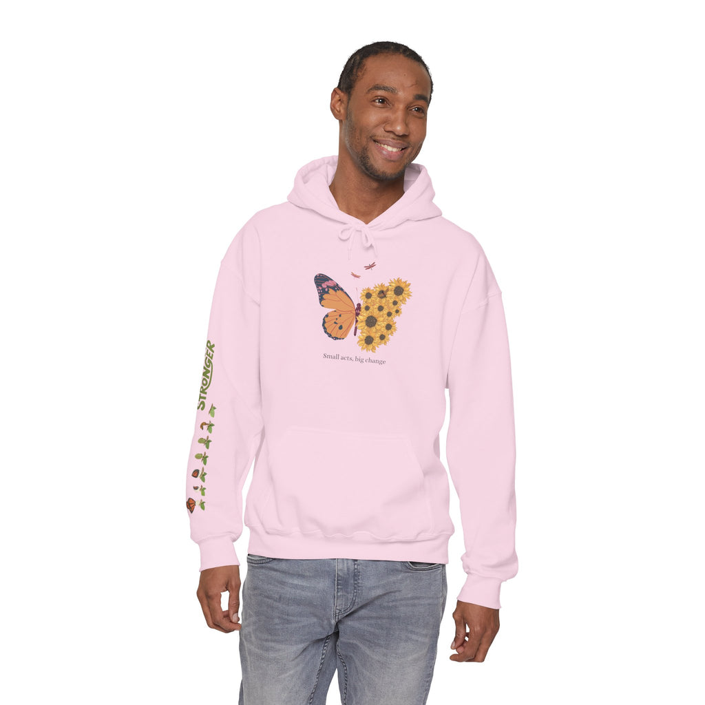 Man wearing a pink hoodie with a butterfly and sunflower design on a white background