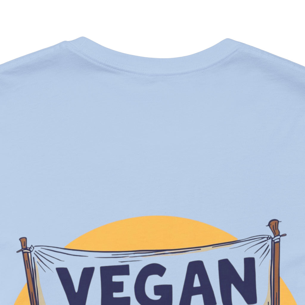 Light blue t-shirt with 'VEGAN' banner design on a white background