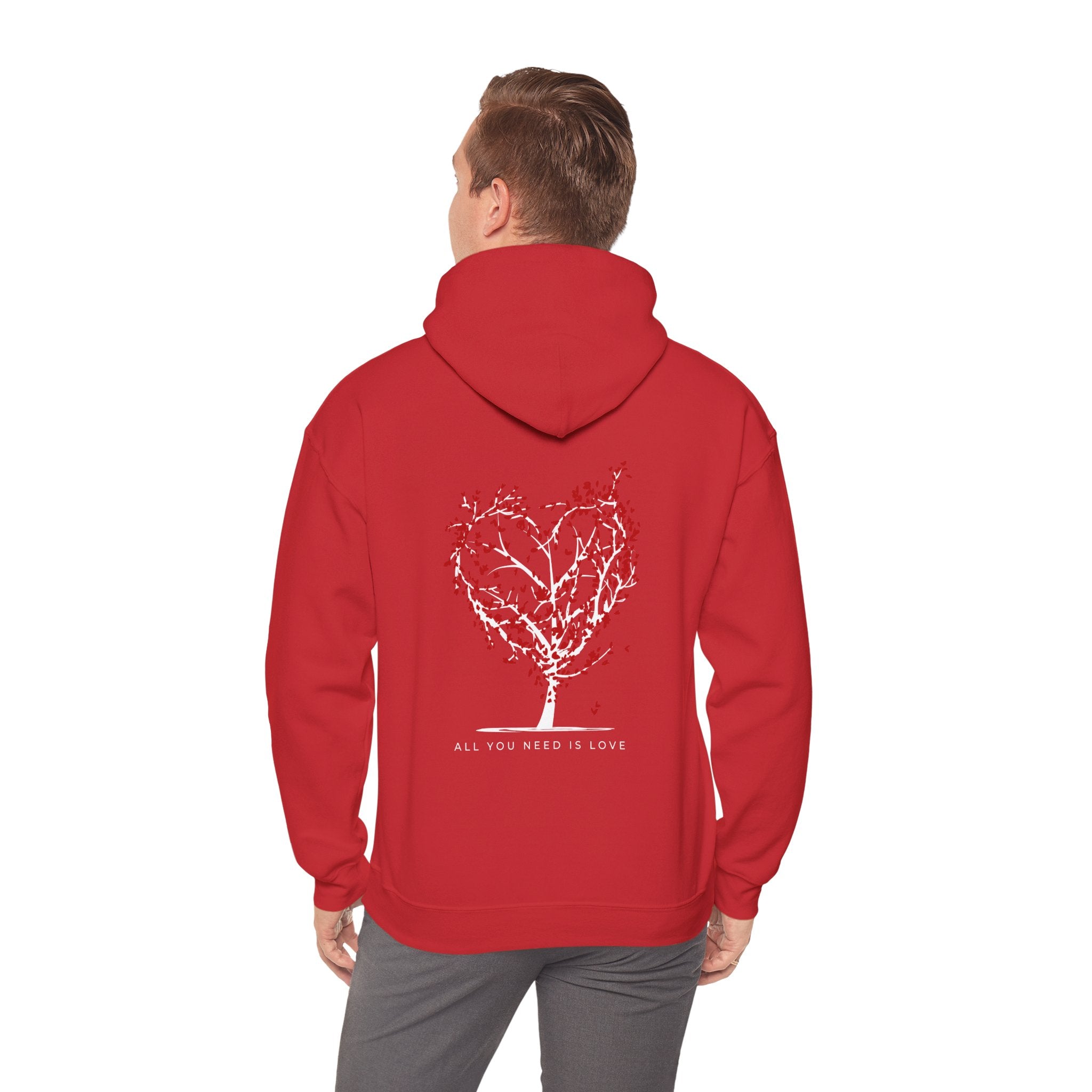 Red hoodie with a tree design and text on the back, worn by a person.