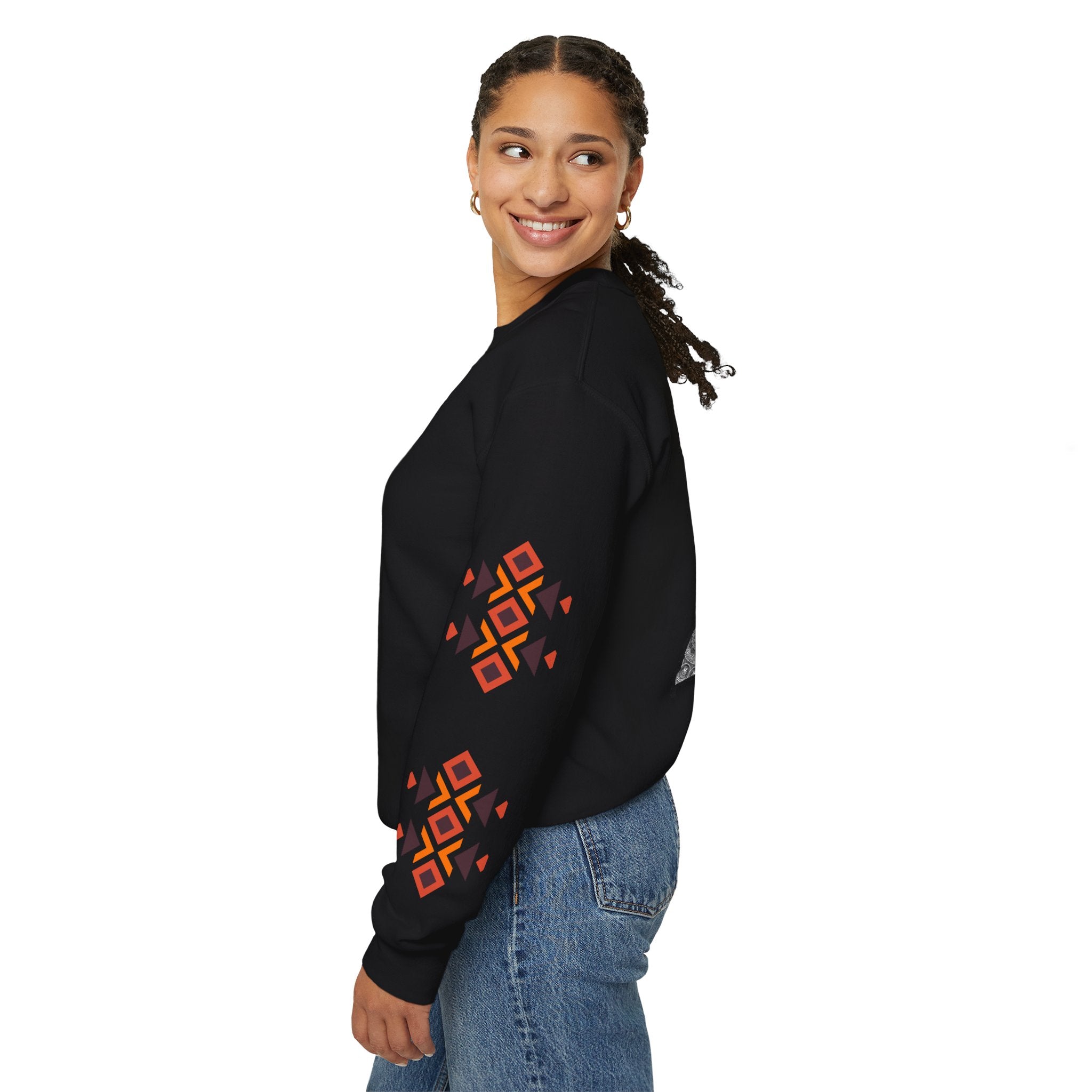 Woman wearing a black sweatshirt with colorful geometric patterns on a white background