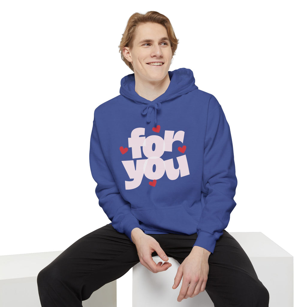 Person wearing a blue hoodie with 'For You' text and hearts on a white background