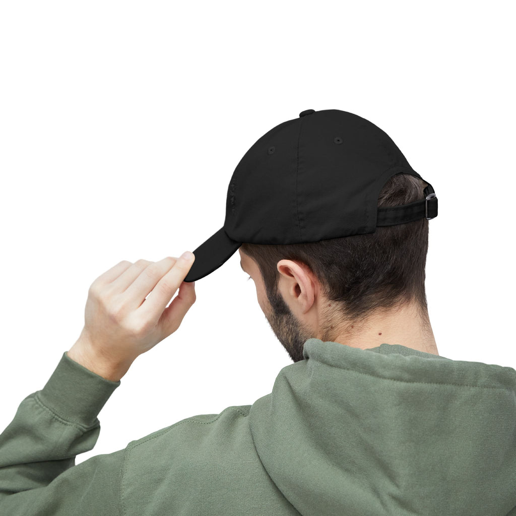 Person wearing a black cap and green hoodie on a white background