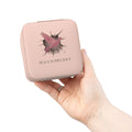 Pink case with a bird design and 'Peace is Precious' text held by a hand on a white background