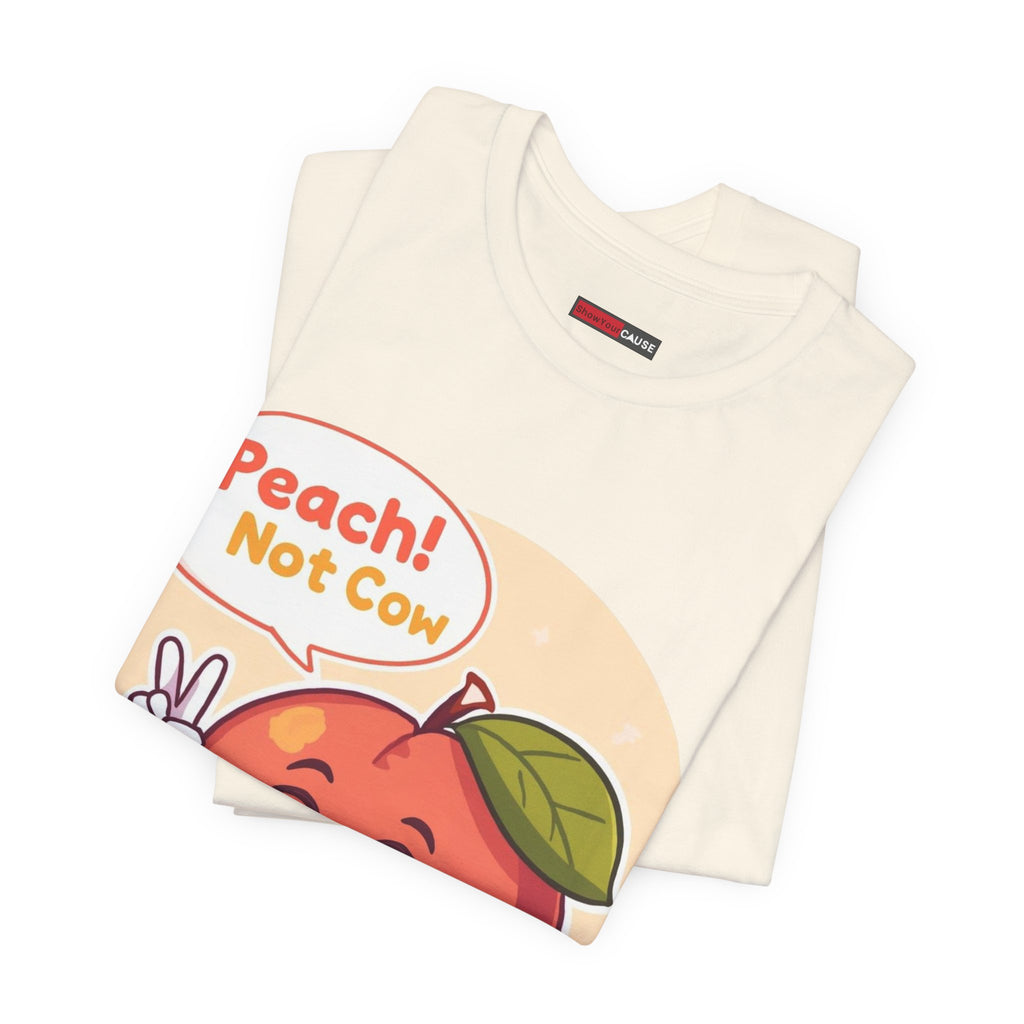 Folded t-shirt with a peach graphic and text on a white background