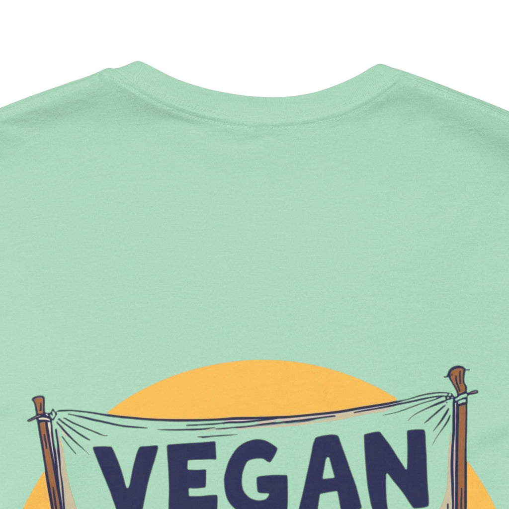 Light green t-shirt with 'VEGAN' text and a yellow circle on a white background