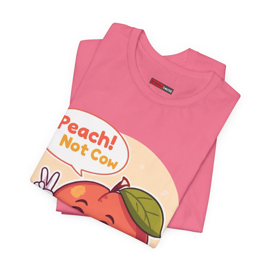 Pink t-shirt with a graphic of a peach and text 'Peach! Not Cow' on a white background