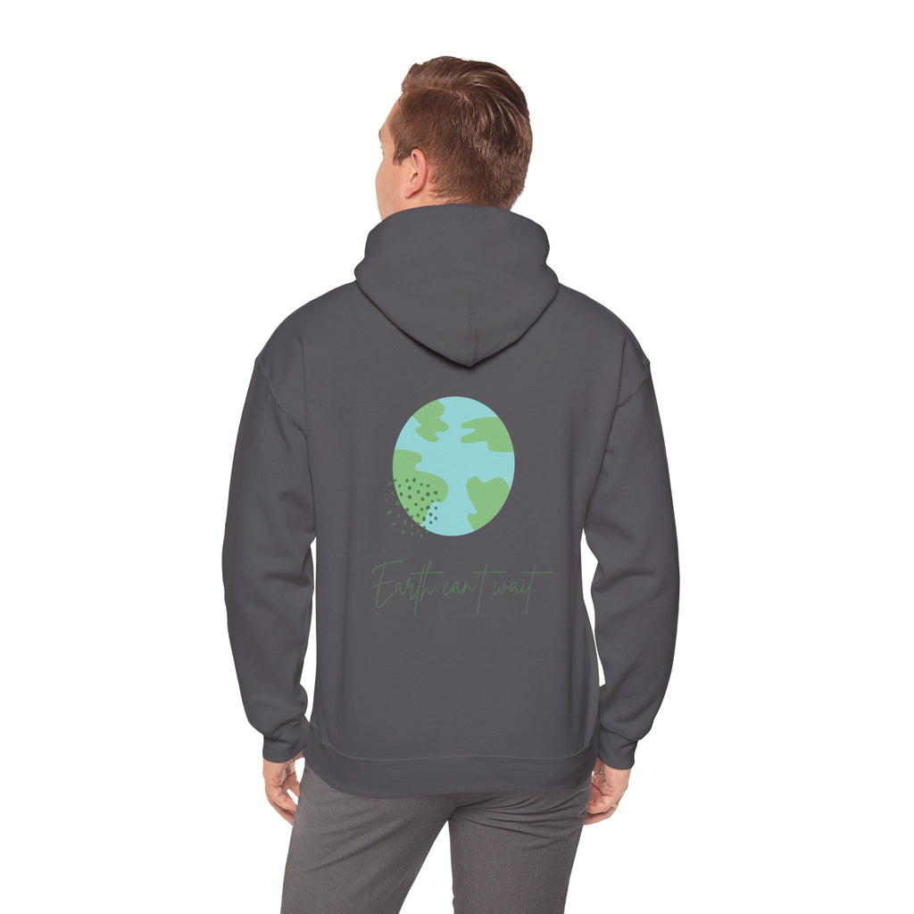 Person wearing a gray hoodie with a green Earth design on the back