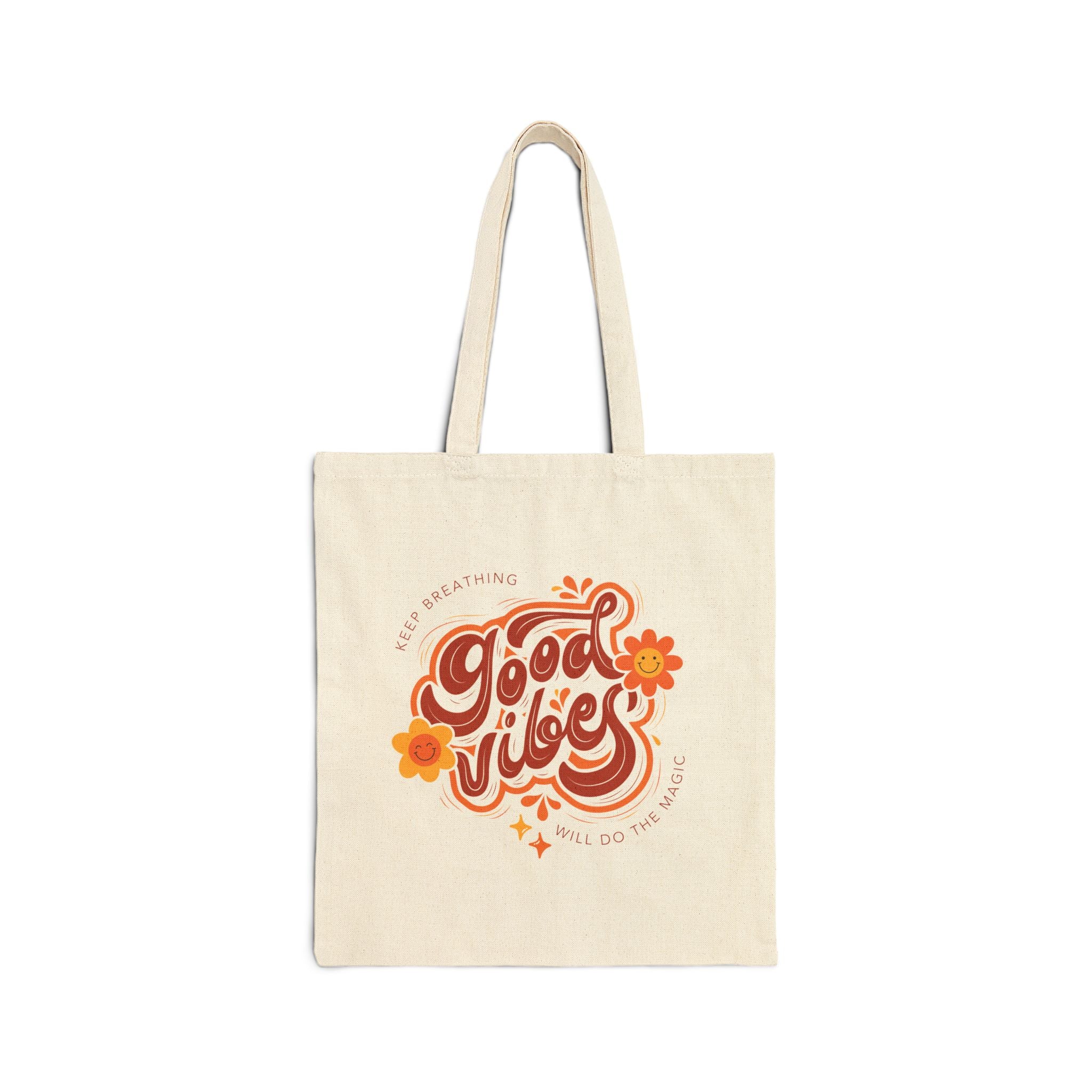 Beige tote bag with 'Good Vibes' text and floral design on a white background
