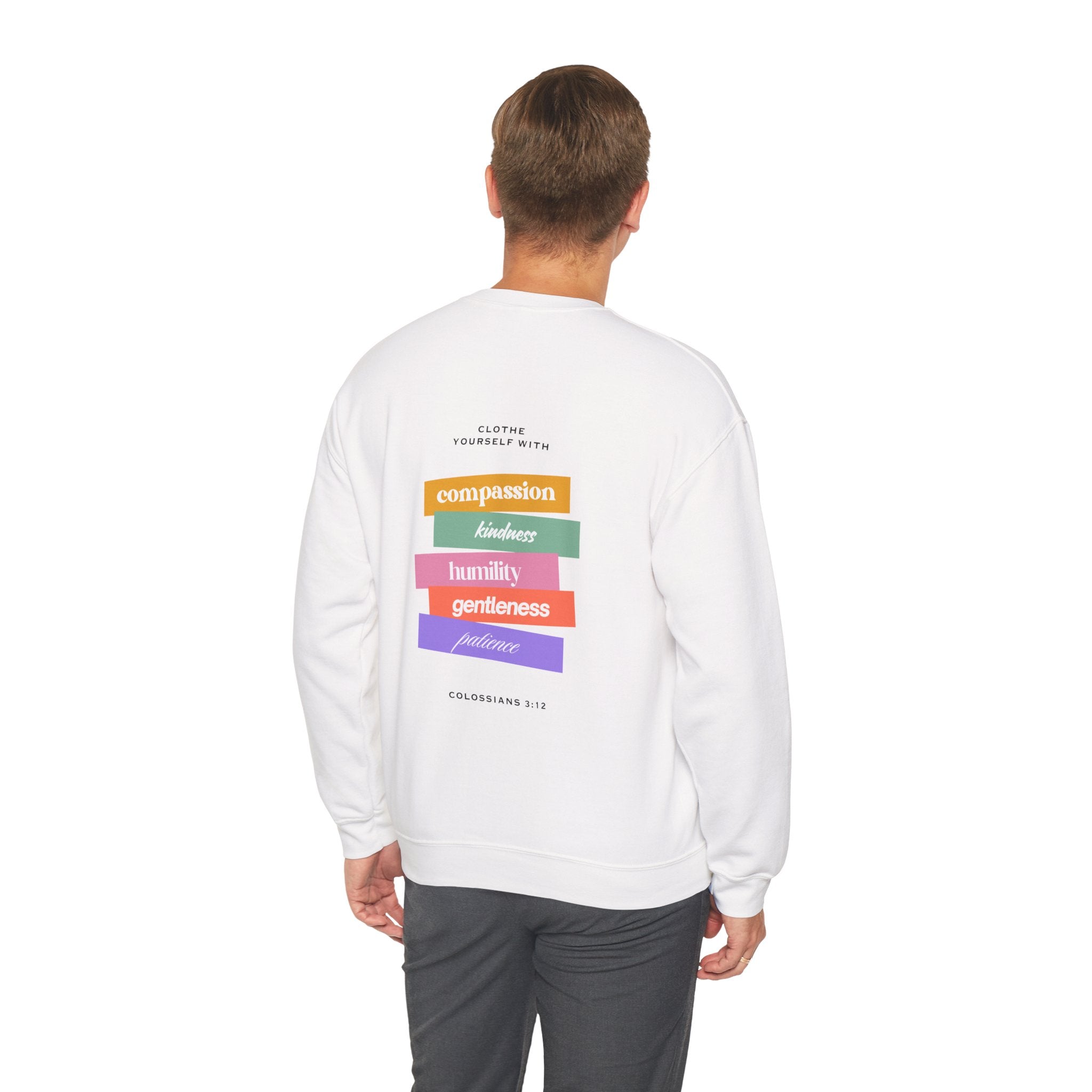 Person wearing a white sweatshirt with colorful text on the back against a white background