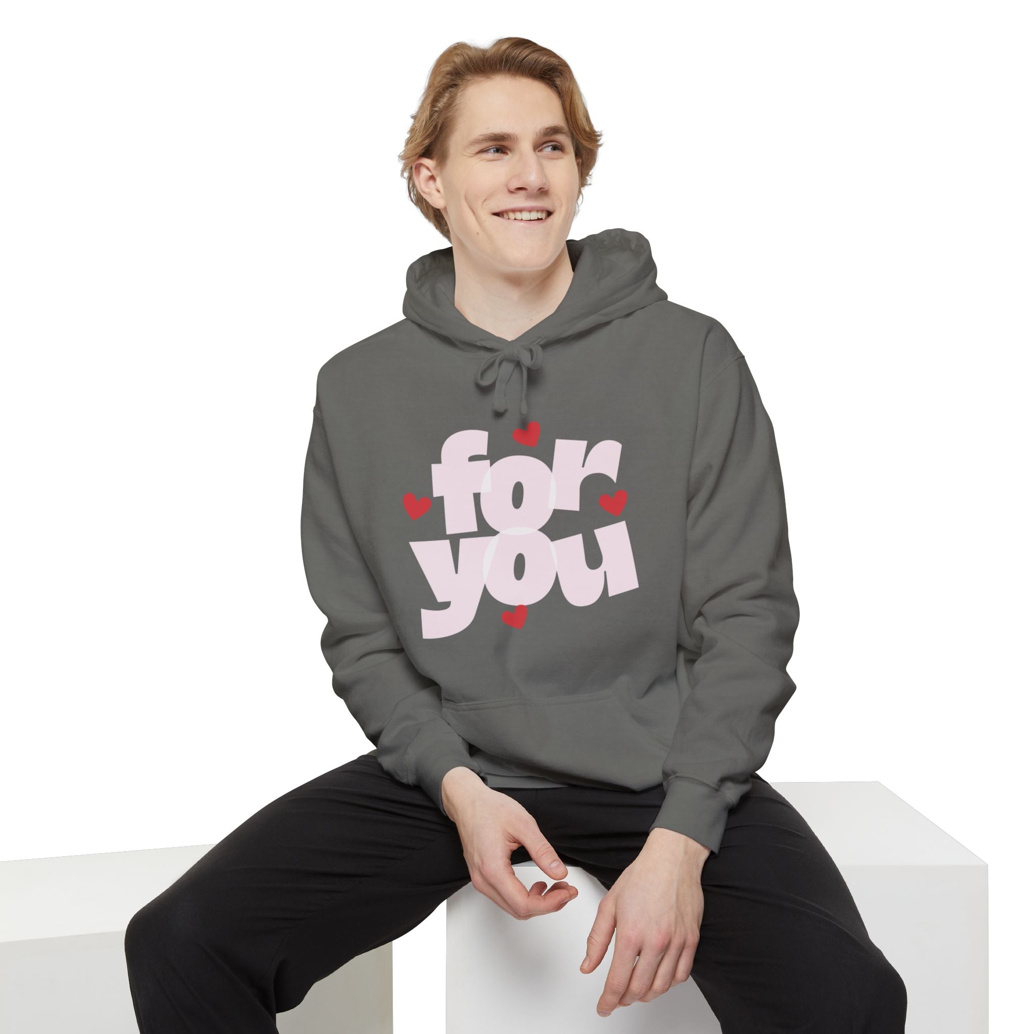 Person wearing a gray hoodie with 'for you' text and hearts on a white background