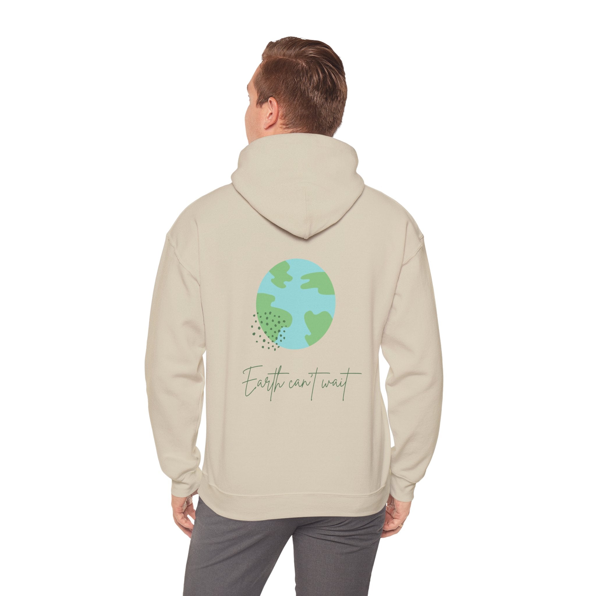 Person wearing a beige hoodie with a graphic of the Earth and text on the back, on a white background