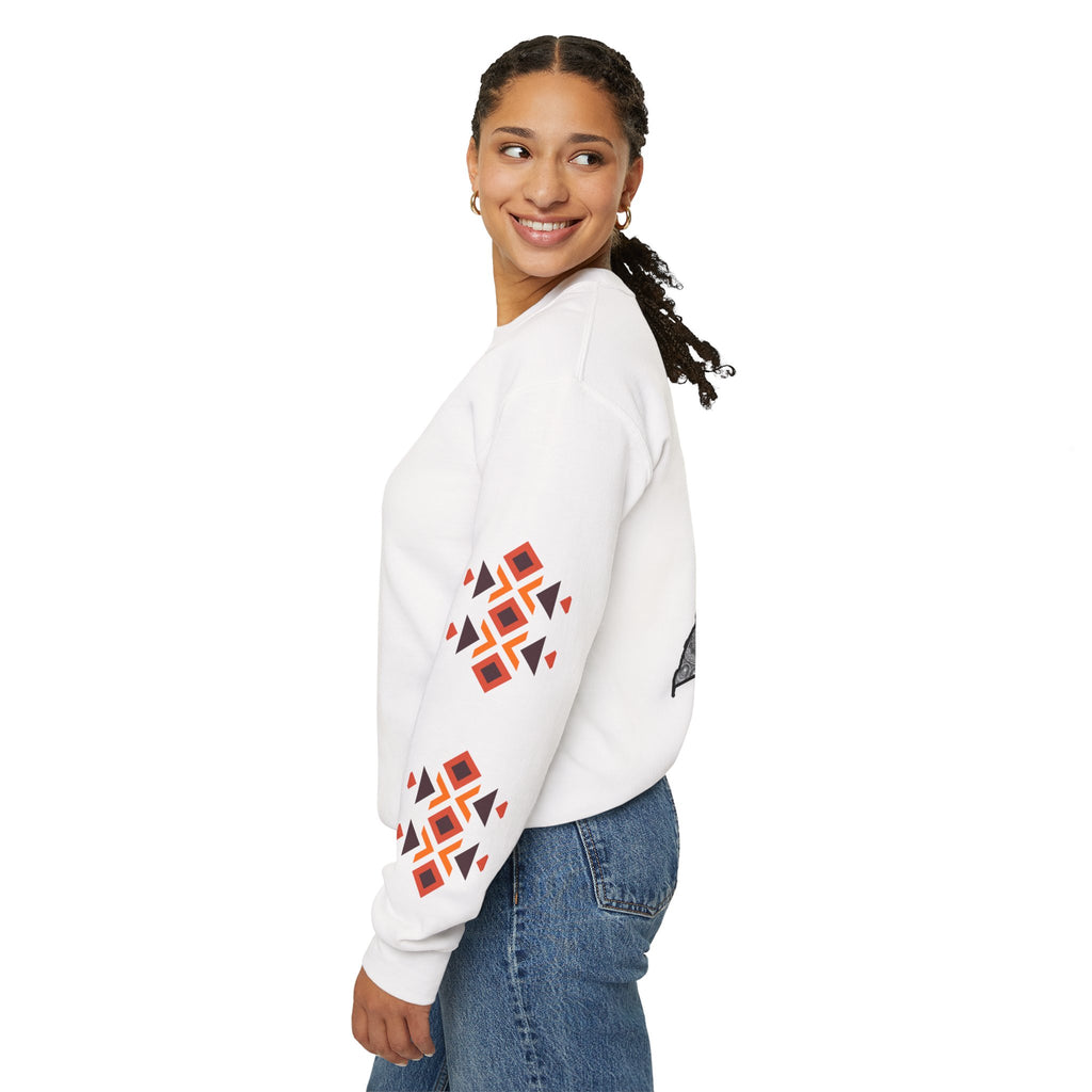 Woman wearing a white sweater with geometric patterns on a white background