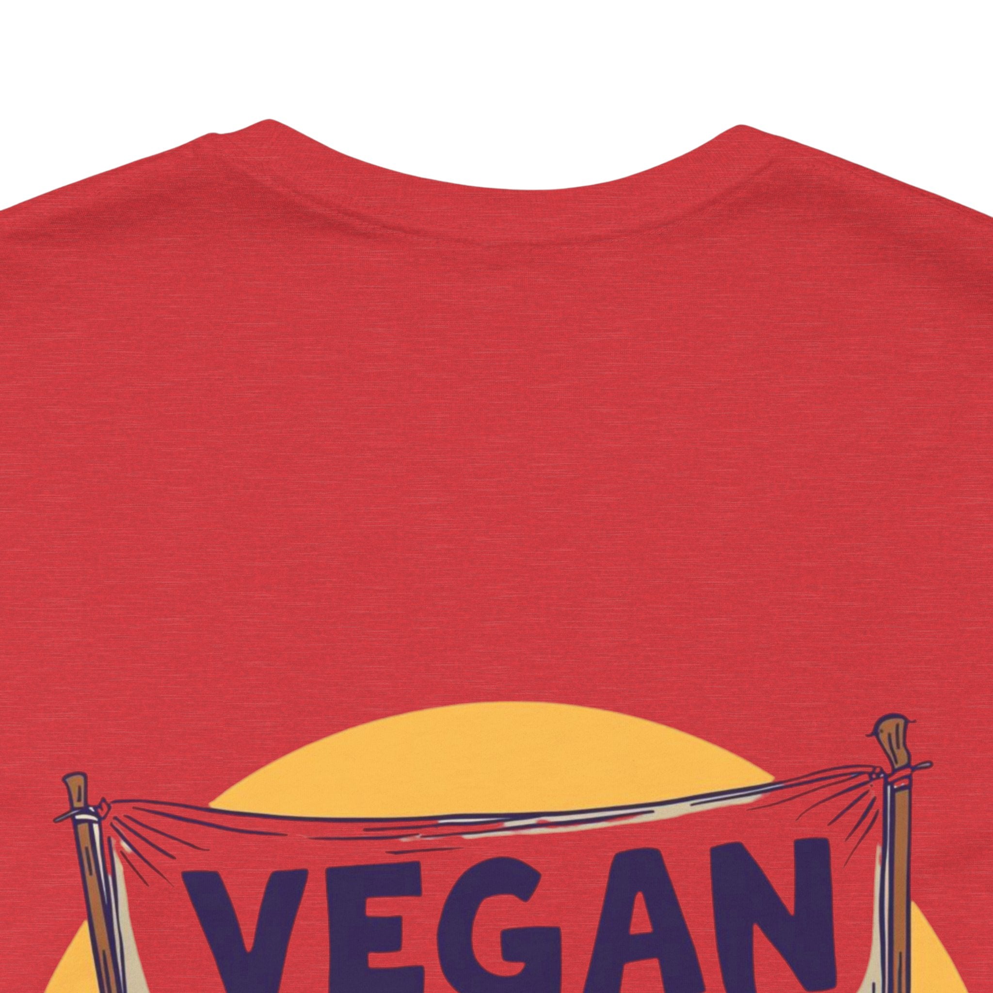 Red t-shirt with a 'VEGAN' banner design on a white background