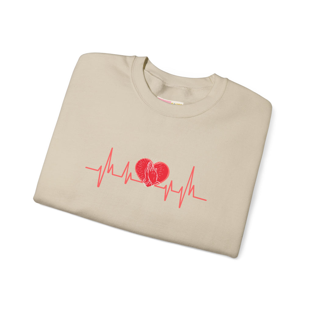 Beige t-shirt with red heart and heartbeat line design on a white background