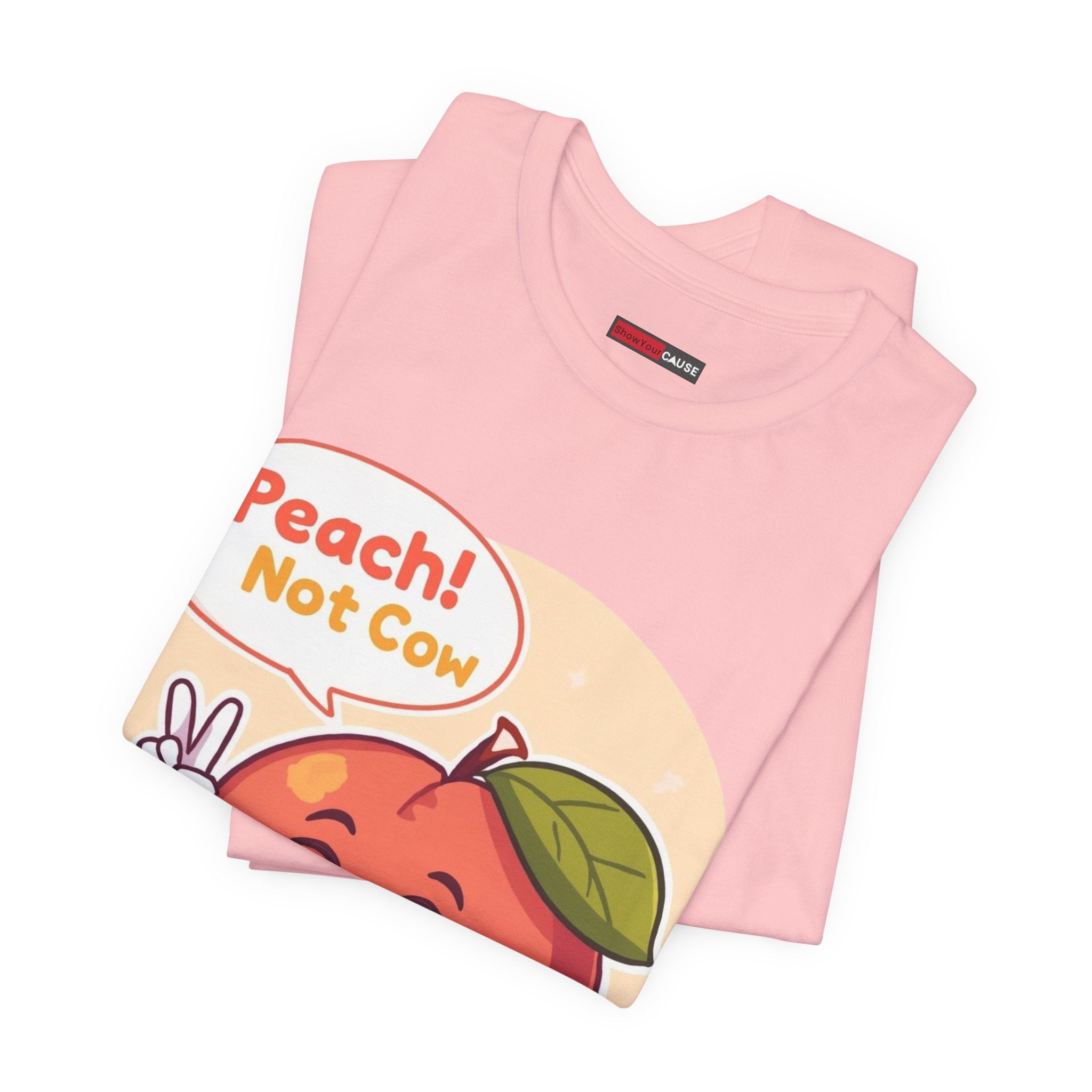 Pink t-shirt with a cartoon peach and text 'Peach! Not Cow' on a white background