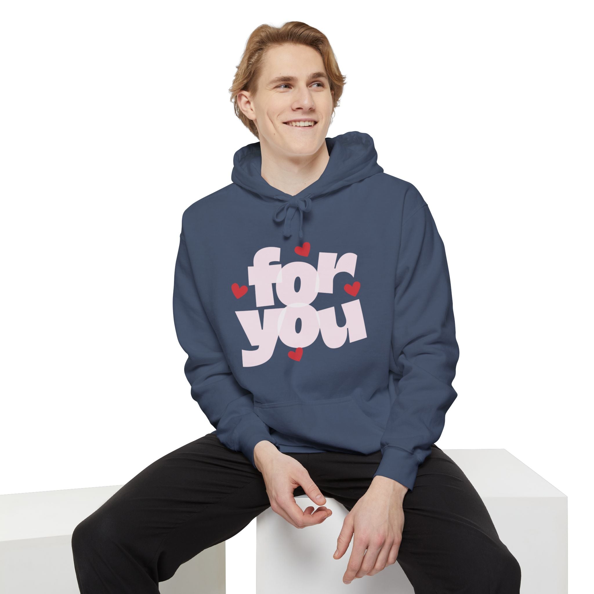 Person wearing a blue hoodie with 'for you' text and hearts on a white background