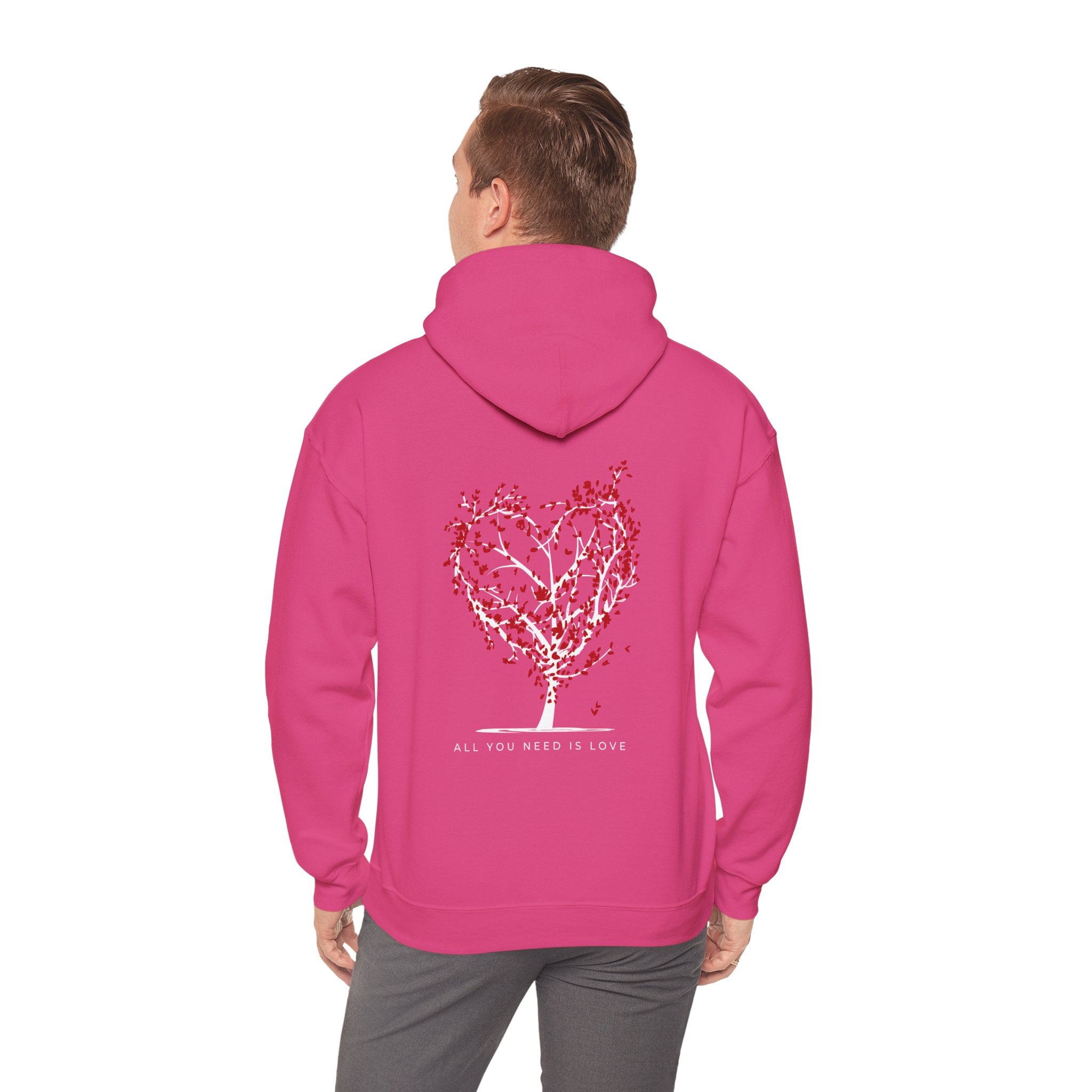 Person wearing a pink hoodie with a heart design and text on the back