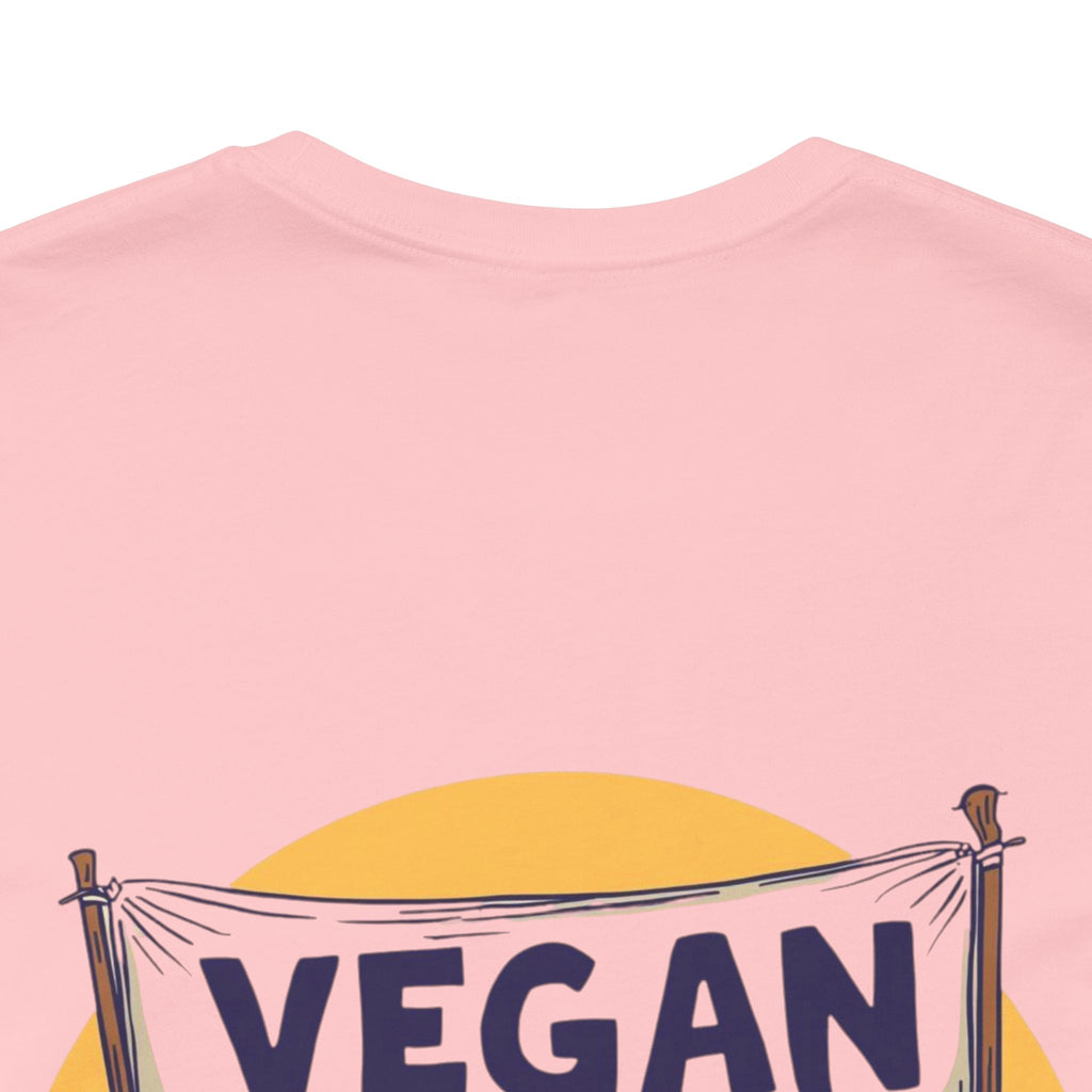 Pink t-shirt with 'VEGAN' banner design on a white background