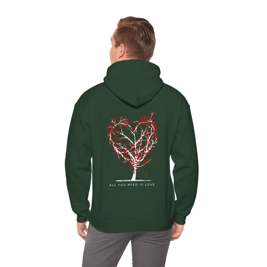 Person wearing a green hoodie with a red heart design and text on the back, on a white background