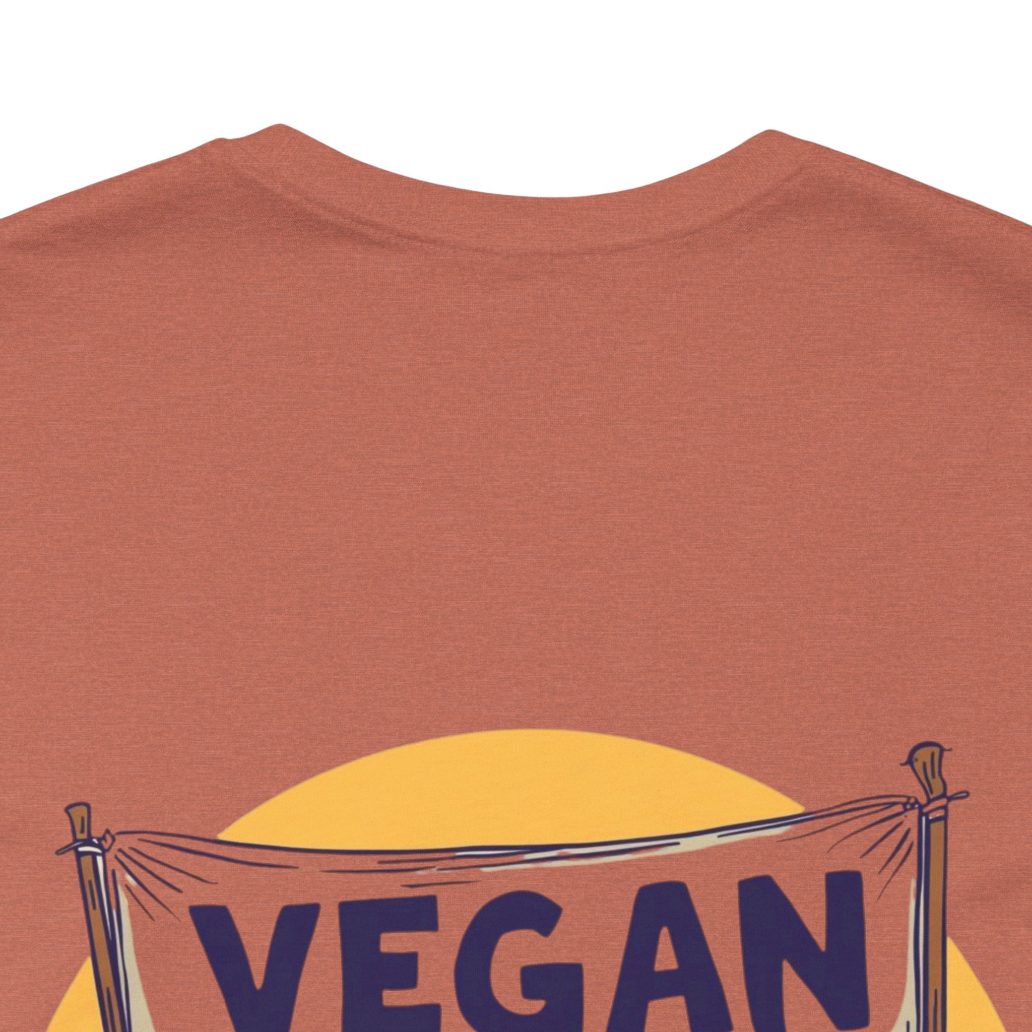 Brown t-shirt with 'VEGAN' banner design on a white background