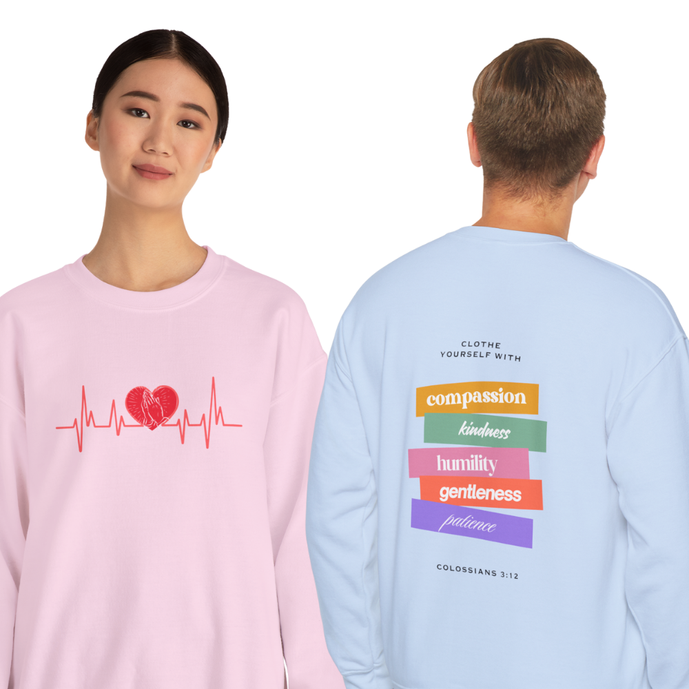 Person wearing a pink long-sleeve shirt with a heart and heartbeat design, and another person wearing a light blue long-sleeve shirt with motivational text.