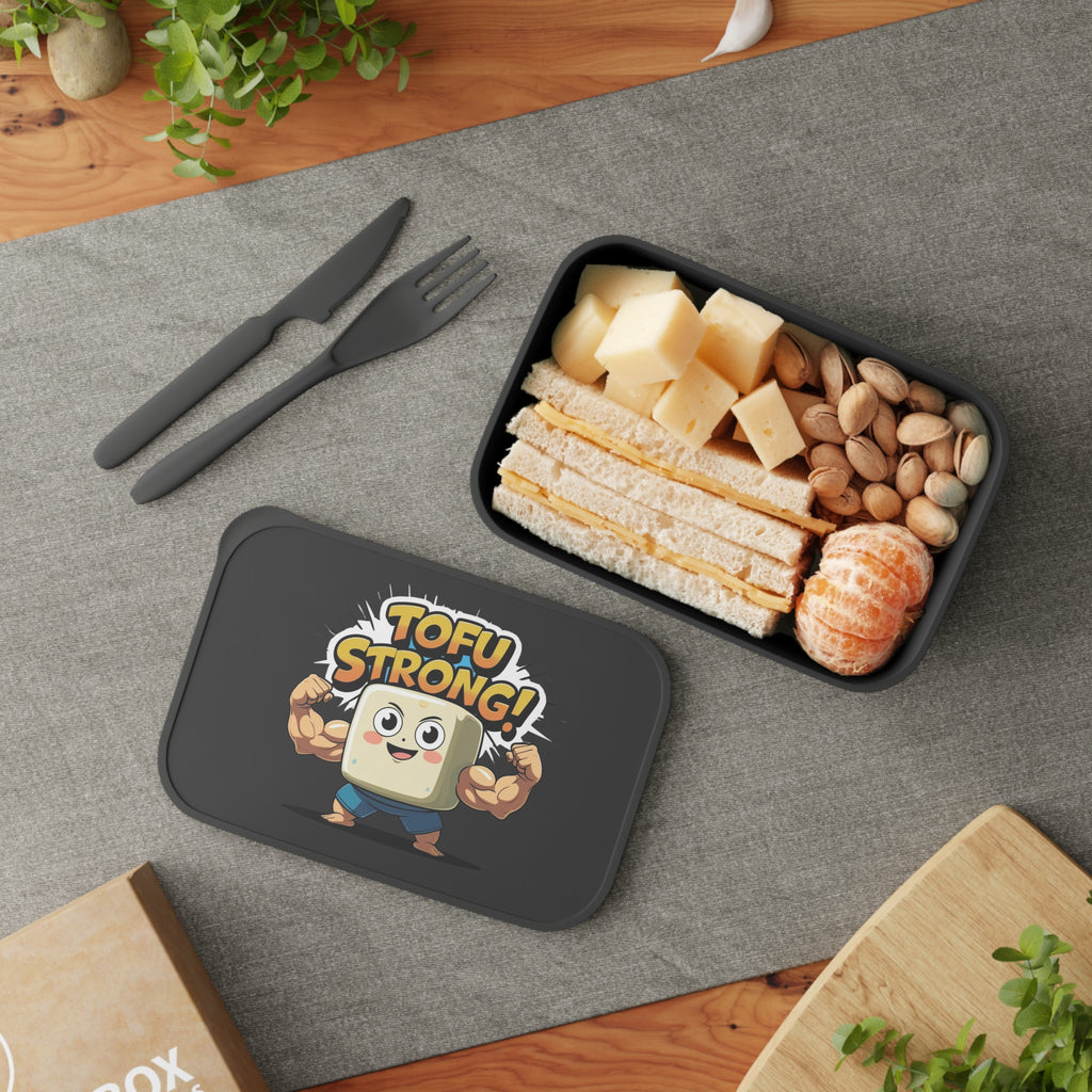 Tofu-themed lunch box with snacks on a gray surface
