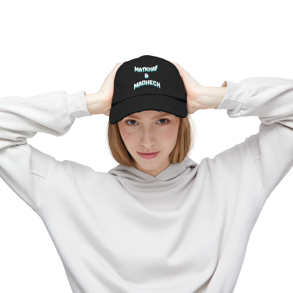 Person wearing a black cap with white text on a white background