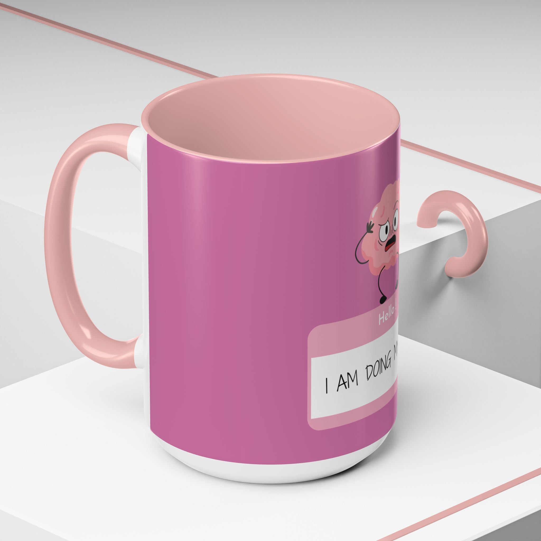 Pink mug with a cartoon character on a white surface