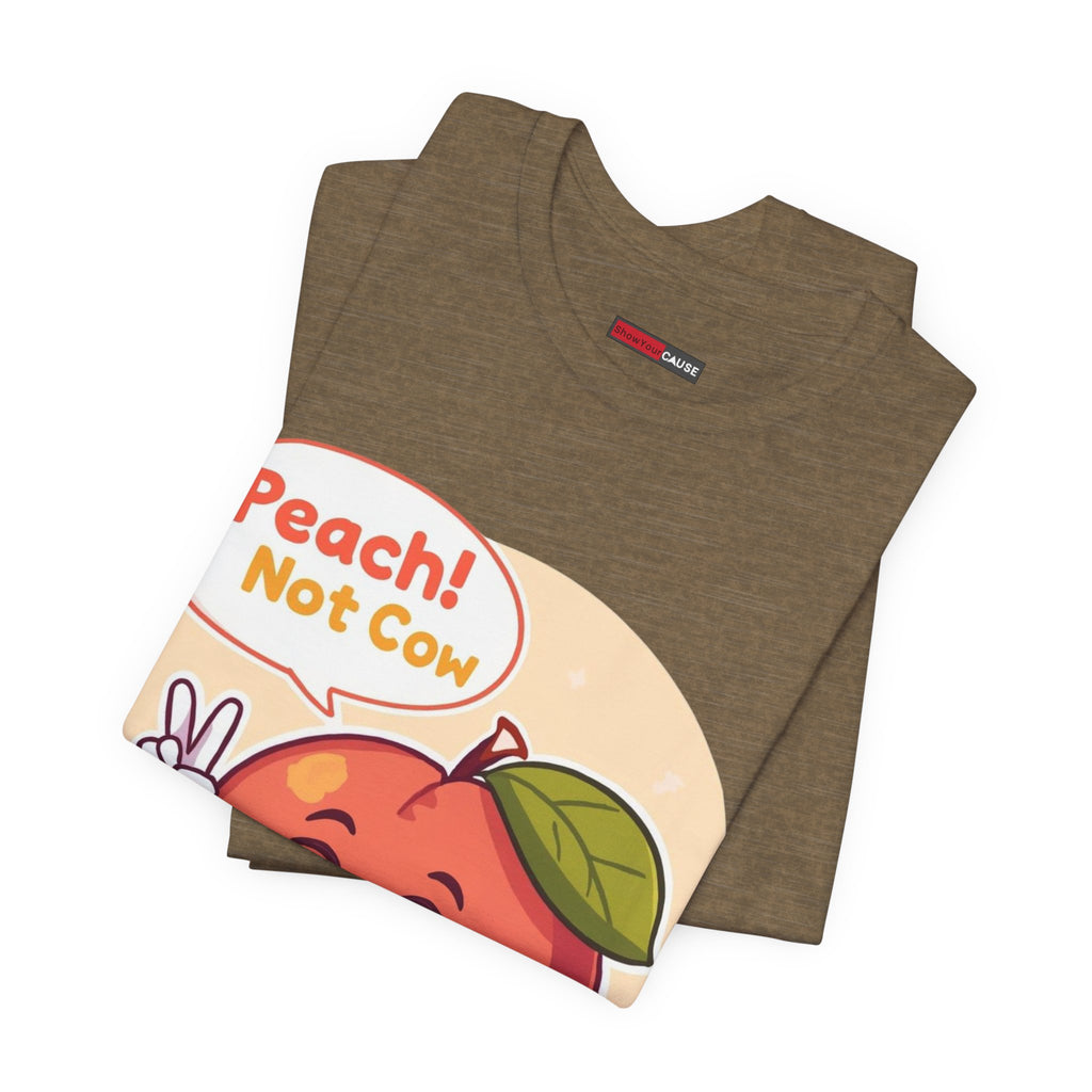 Folded olive t-shirt with a colorful graphic and text 'Peach! Not Cow' on a white background