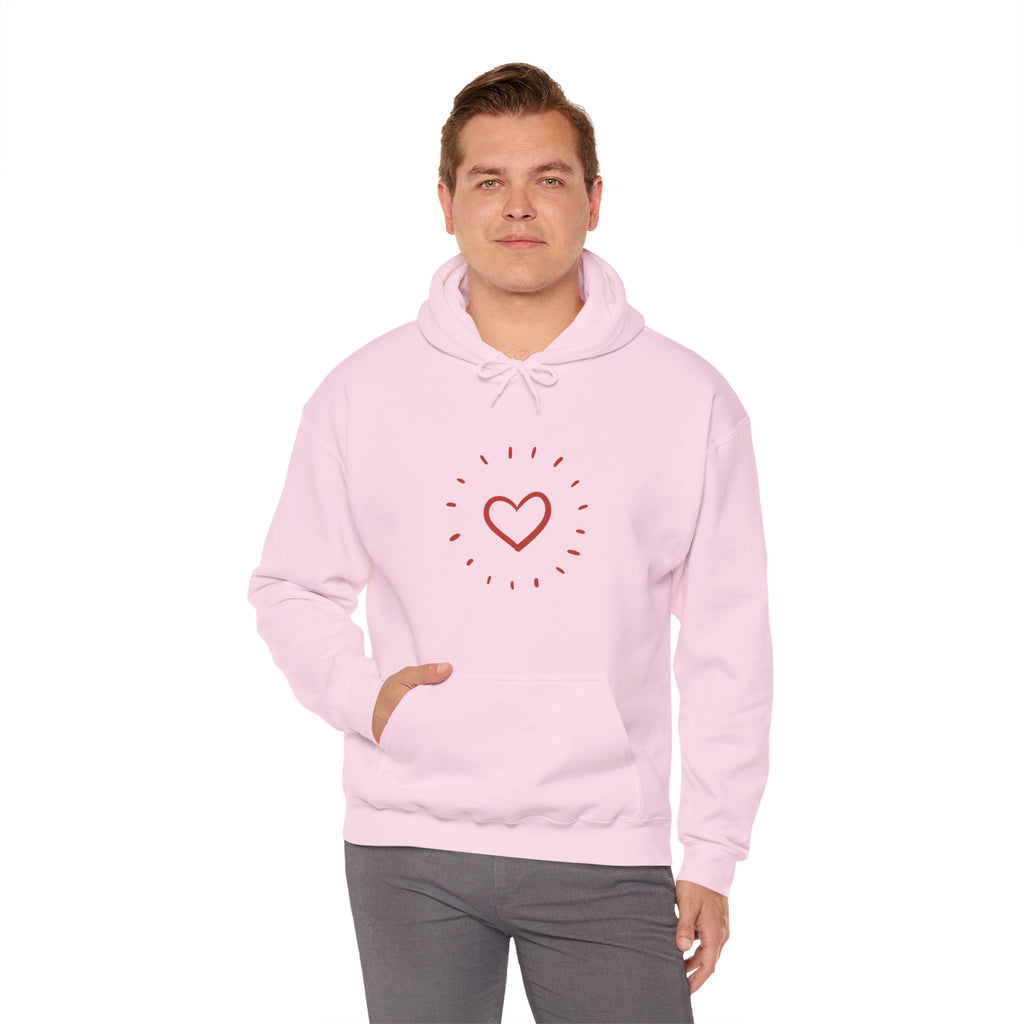 Person wearing a pink hoodie with a heart design on a white background