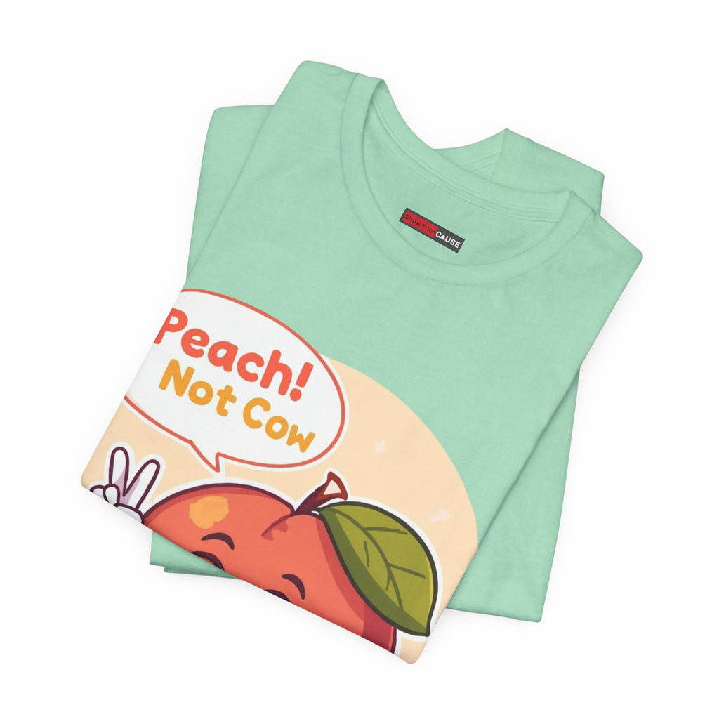 Folded mint green t-shirt with a colorful graphic and text on a white background