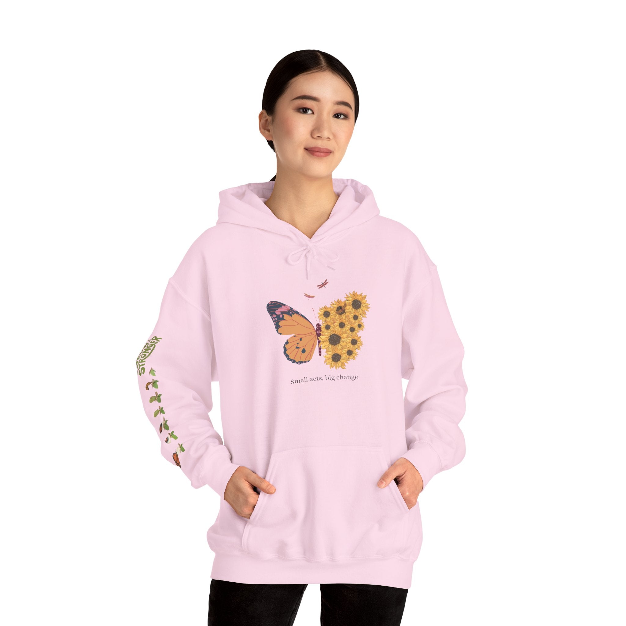 Person wearing a pink hoodie with a butterfly design on a white background