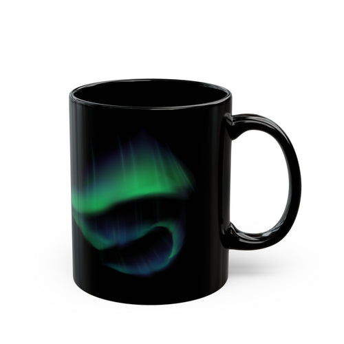 Black mug with a green and blue abstract design on a white background