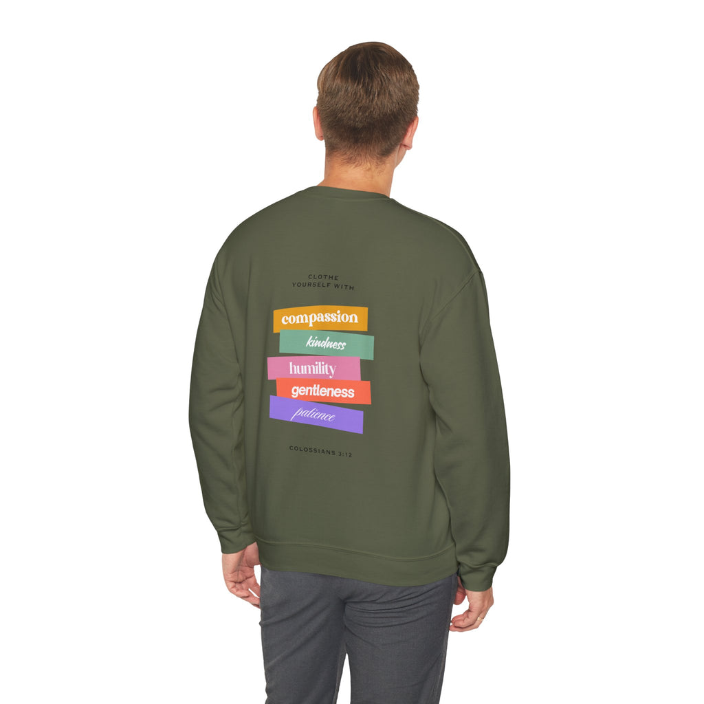 Person wearing a green sweatshirt with colorful text design on the back, on a white background