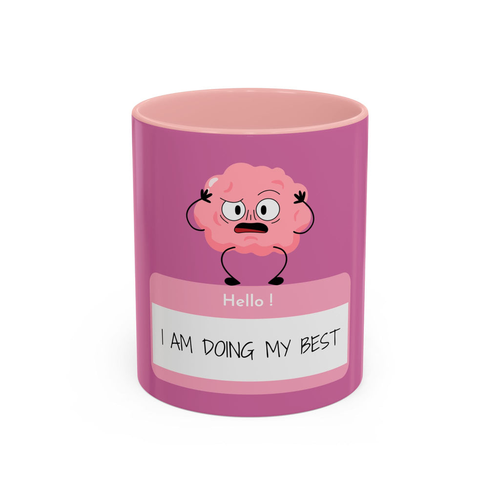 Pink mug with cartoon brain design and text on a white background