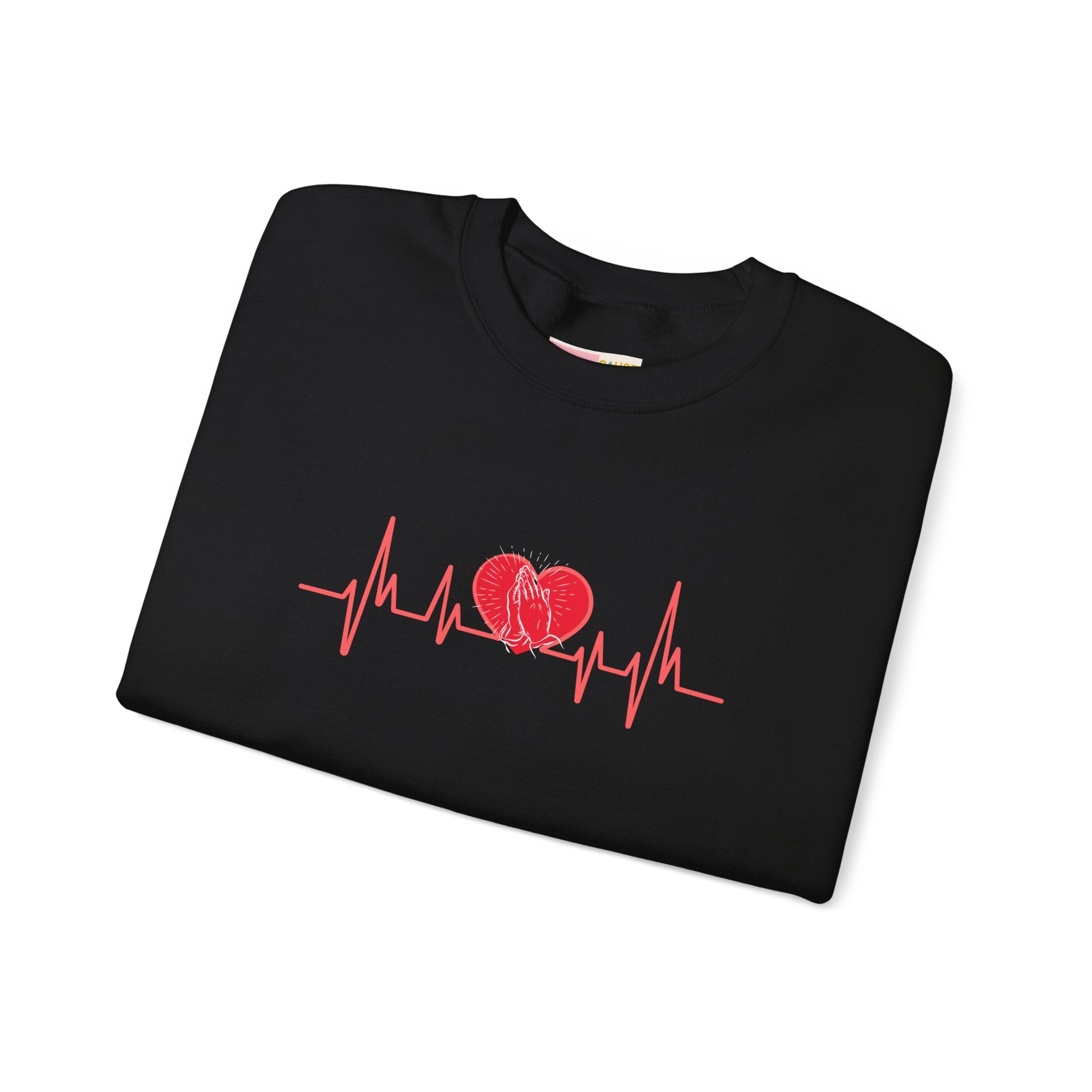 Folded black sweatshirt with red heart and heartbeat line design on a white background