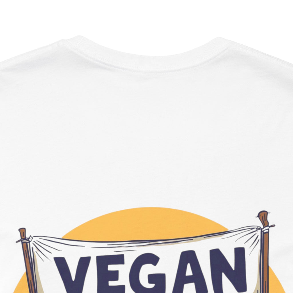 White t-shirt with 'VEGAN' text and yellow circle design on a white background