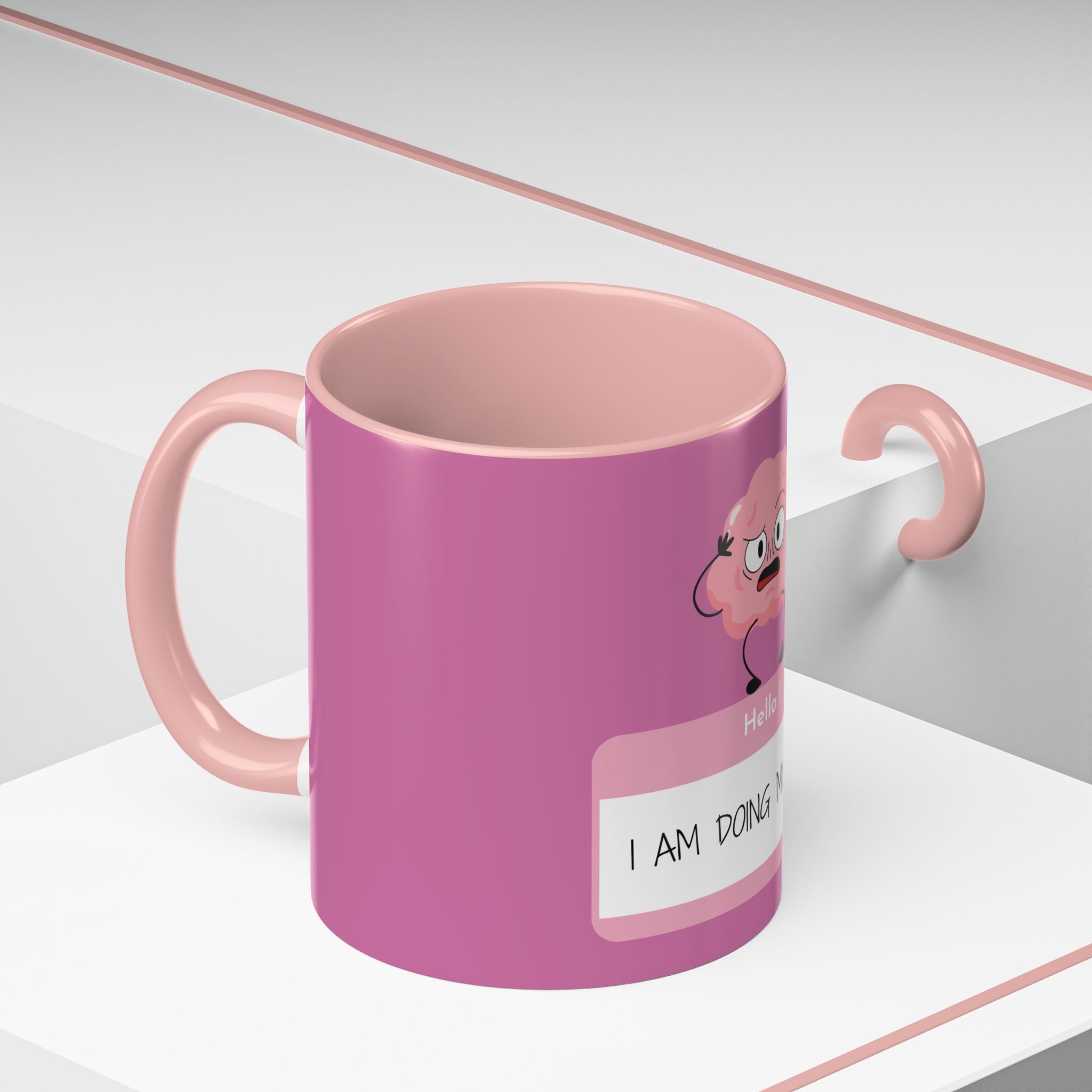 Pink mug with cartoon flamingo design on a white background