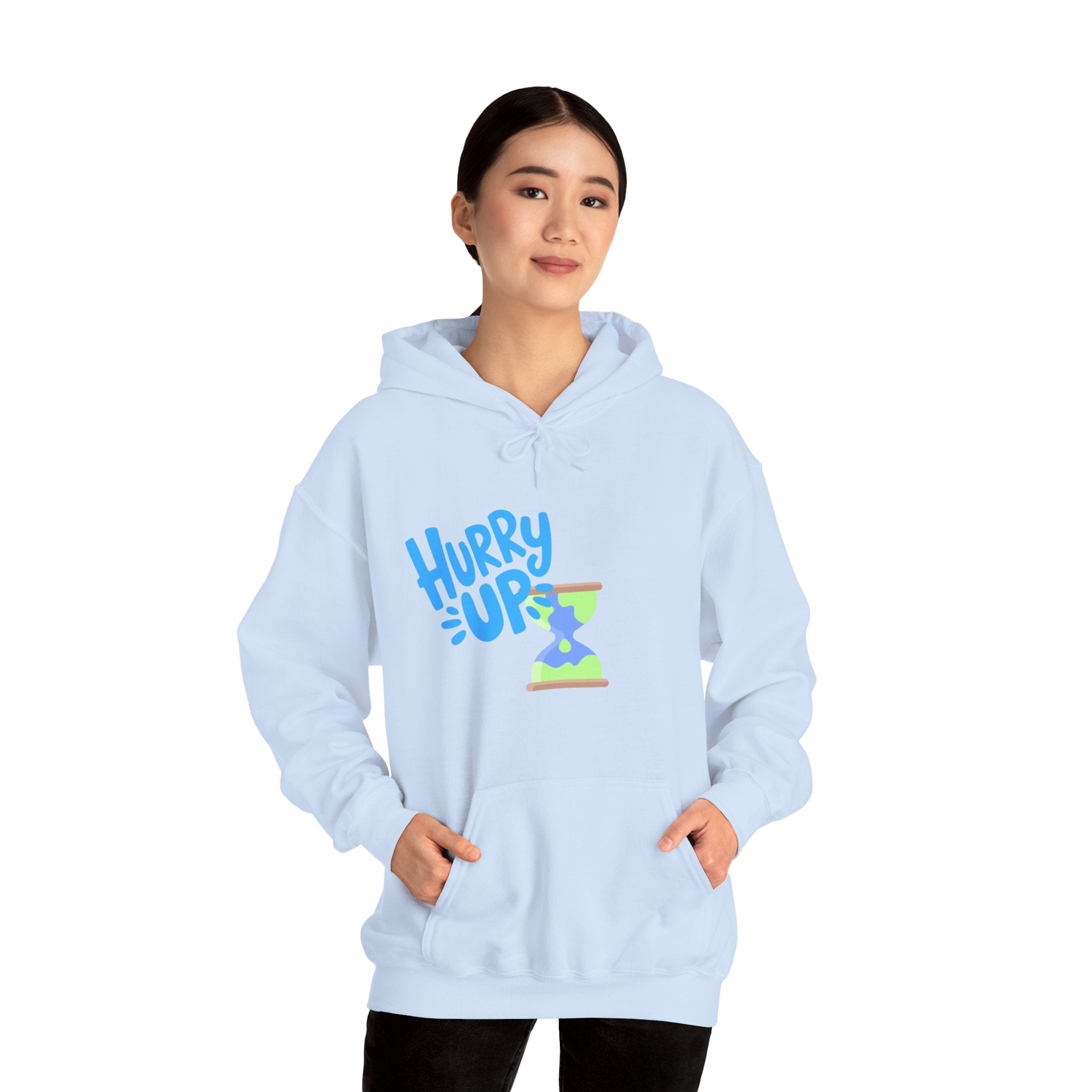 Light blue hoodie with 'Hurry Up' graphic worn by a person on a white background