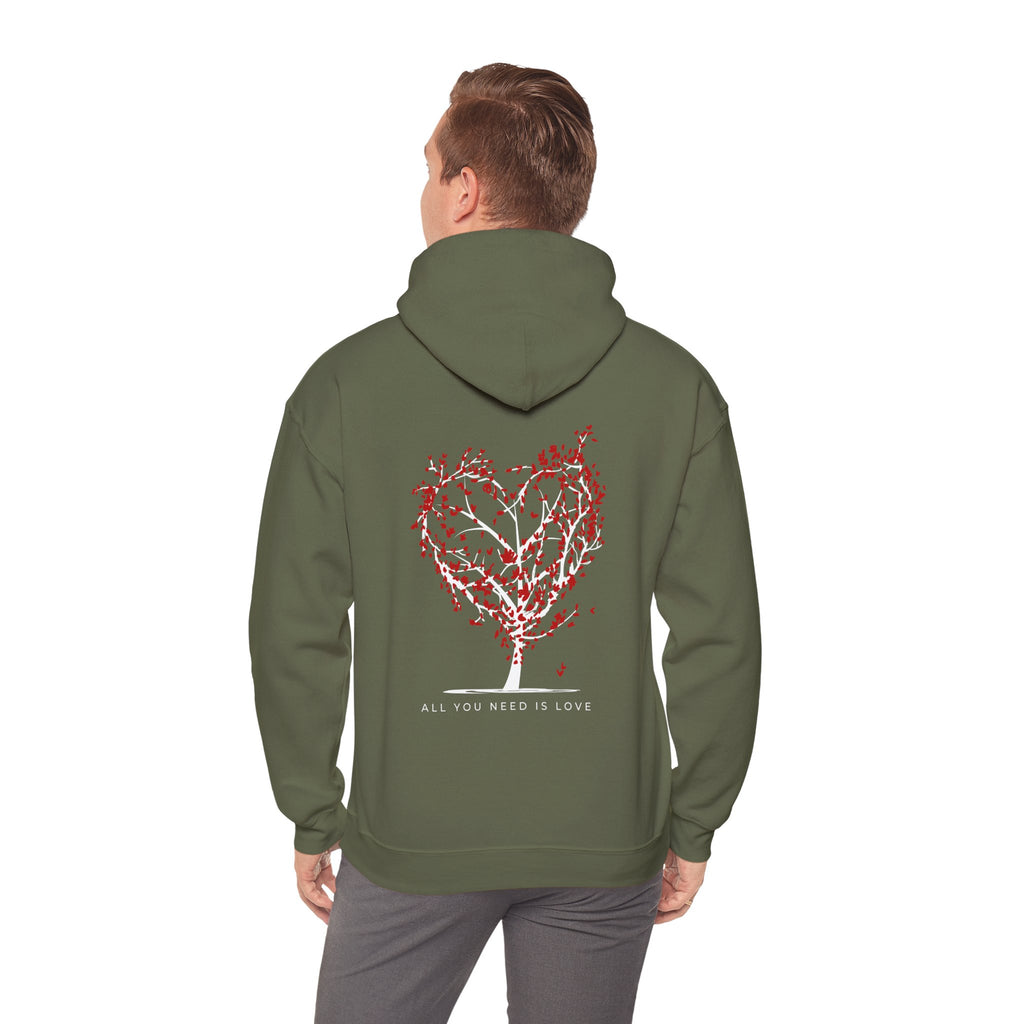 Person wearing a green hoodie with a heart-shaped tree design on the back, on a white background.