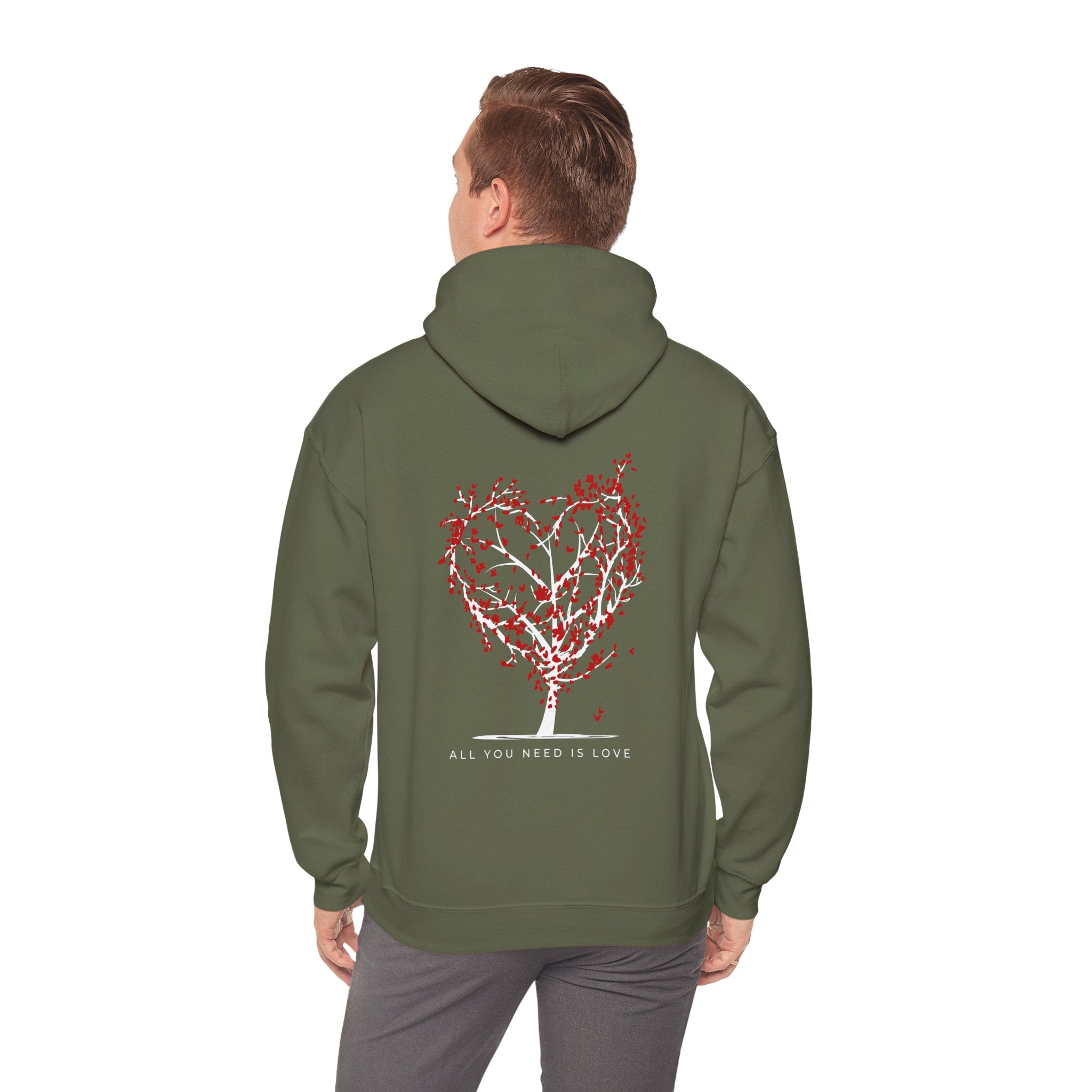 Person wearing a green hoodie with a heart-shaped tree design on the back, on a white background.