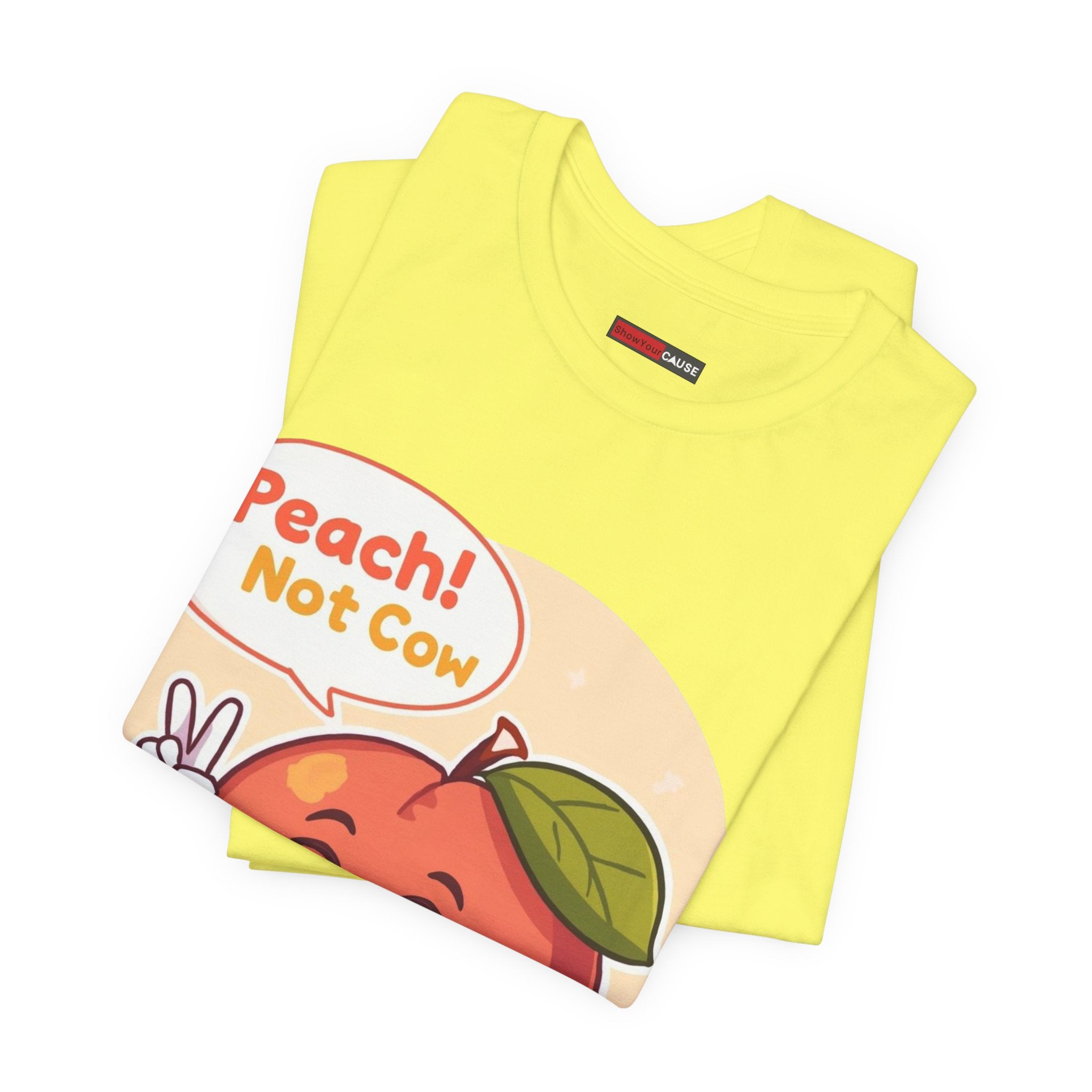 Yellow t-shirt with a peach graphic and text 'Peach! Not Cow' on a white background