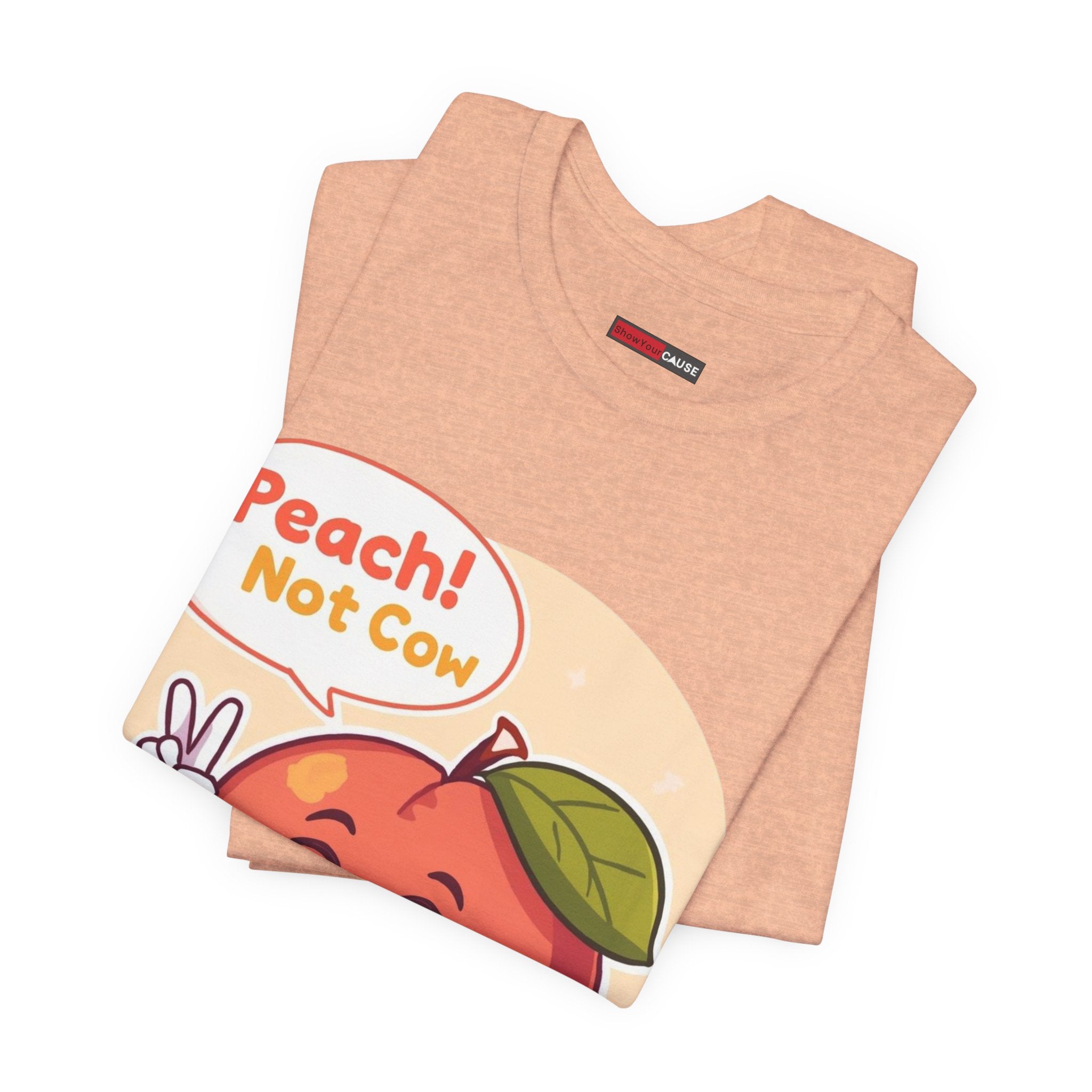 Folded peach-themed t-shirt with a cartoon peach and text on a white background