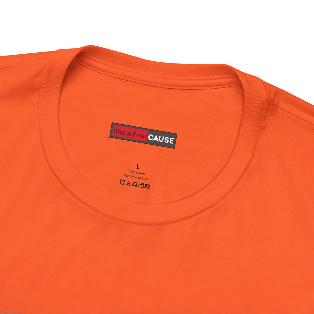 Close-up of an orange t-shirt with a 'Show Your Cause' label on a white background