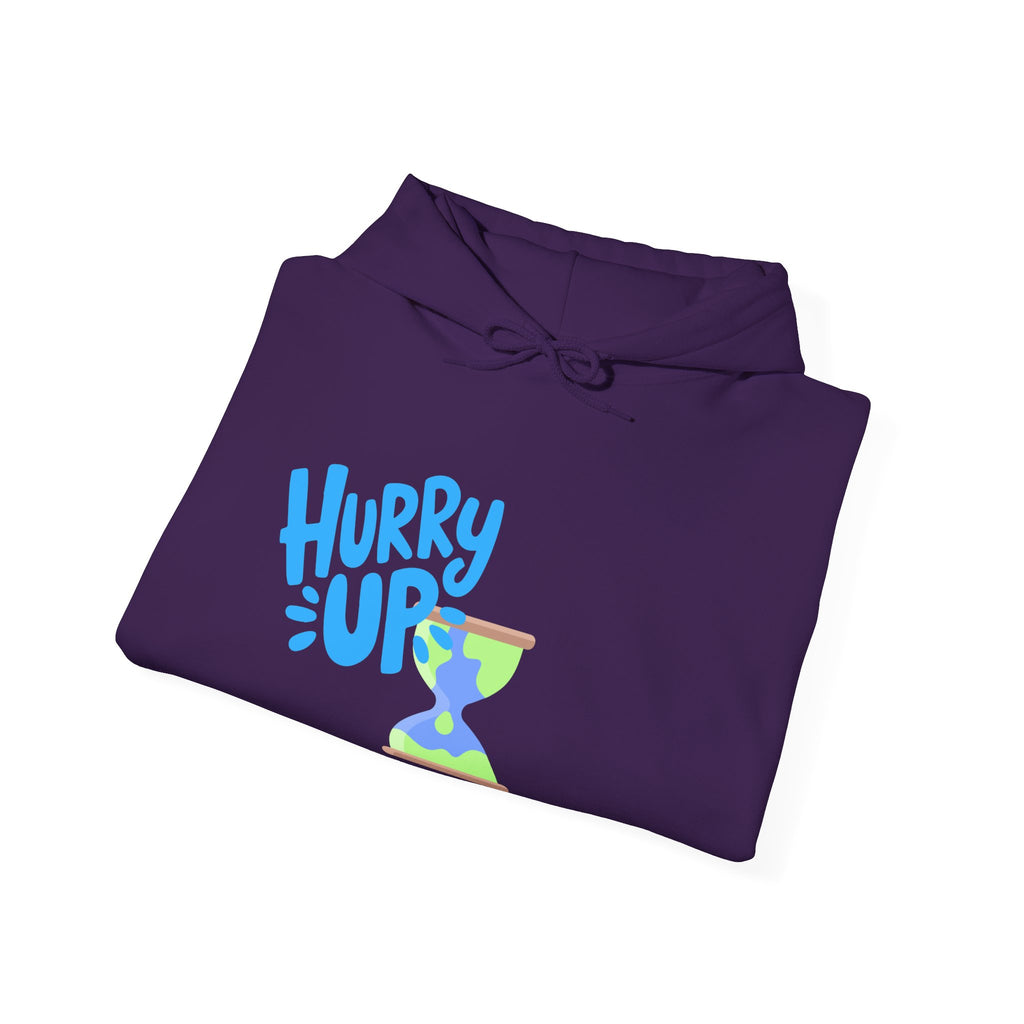 Folded purple hoodie with 'Hurry Up' text and colorful design on a white background