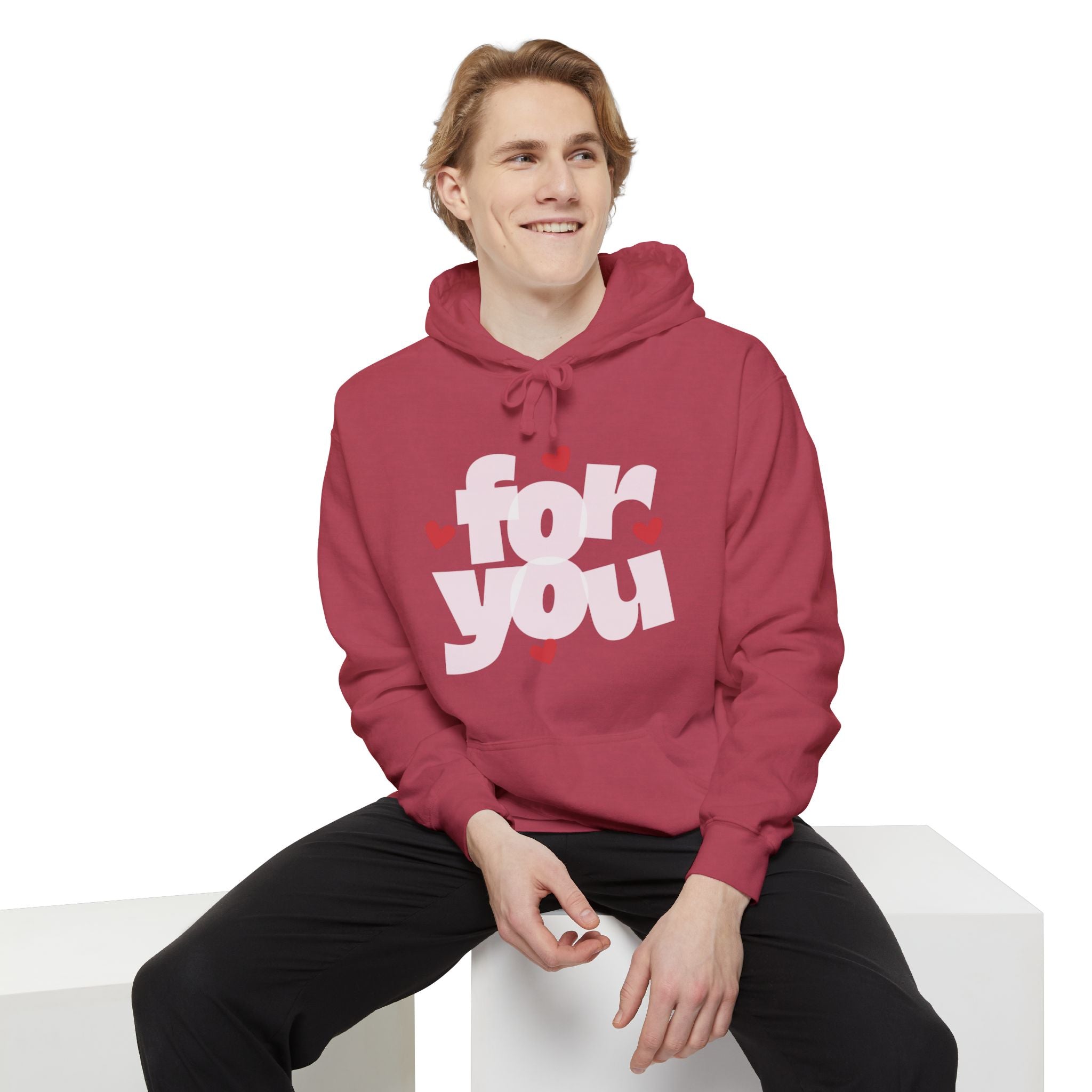 Person wearing a red hoodie with 'for you' text on a white background