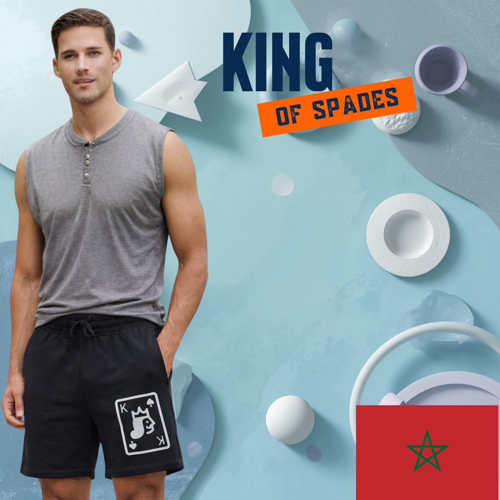 Man wearing a sleeveless shirt and shorts with 'King of Spades' text and Moroccan flag on a blue background.
Black shorts, King of Spades playing card graphic, musical note with crown face design, ShowYourIdentity collection, bold streetwear, artistic fashion, music and royalty theme, unique urban apparel.
- “Melek dyal music.”
- “Spades w crown, identity strong.”
- “ShowYourIdentity, show your vibe.”
- “Music hiya lpower dyalek.”
