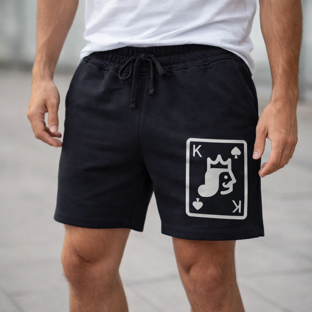 Black shorts with a white graphic design on a neutral background